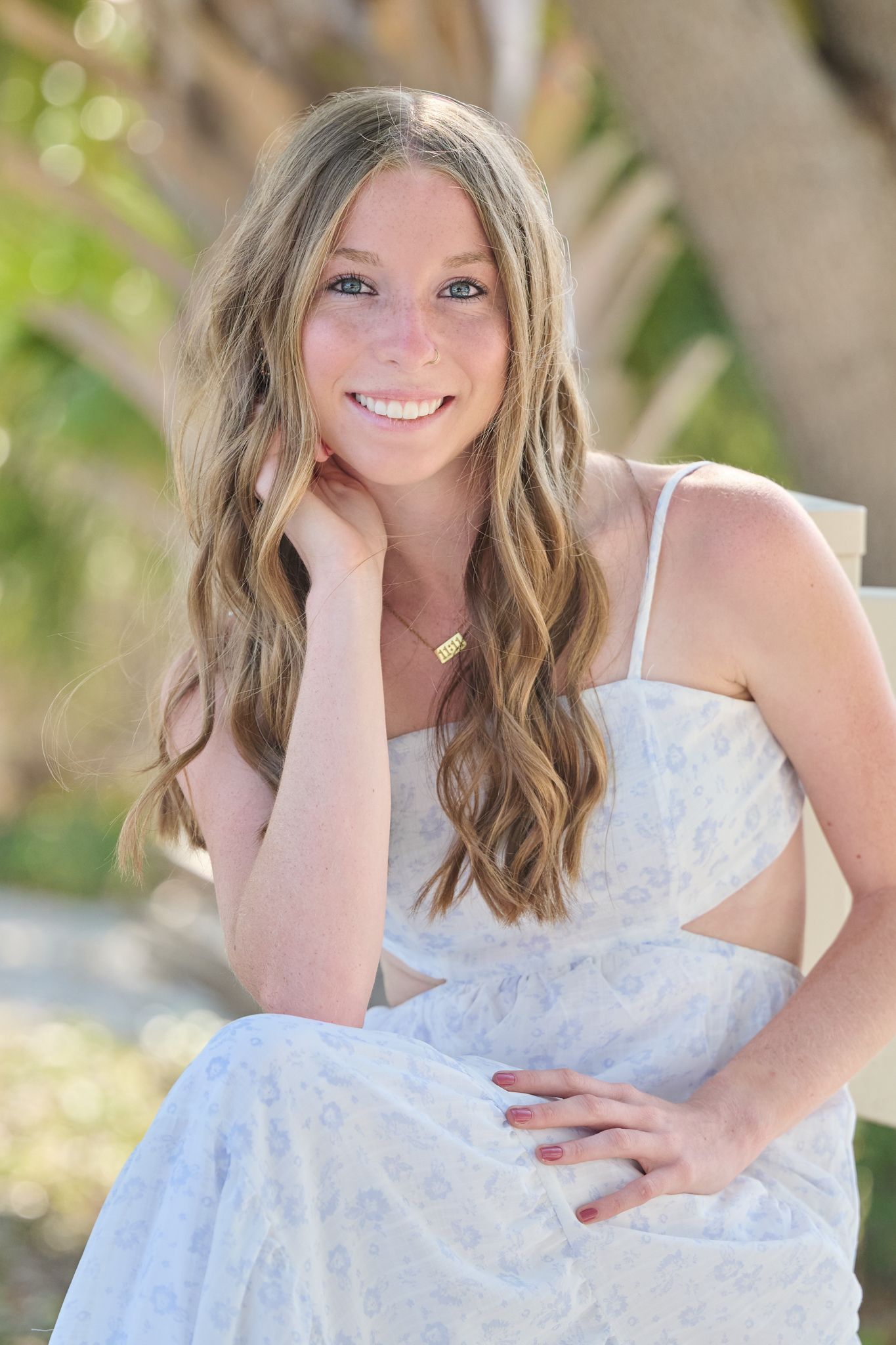 A person in a white lace dress poses outdoors in a series of casual portraits with natural lighting and bokeh background.