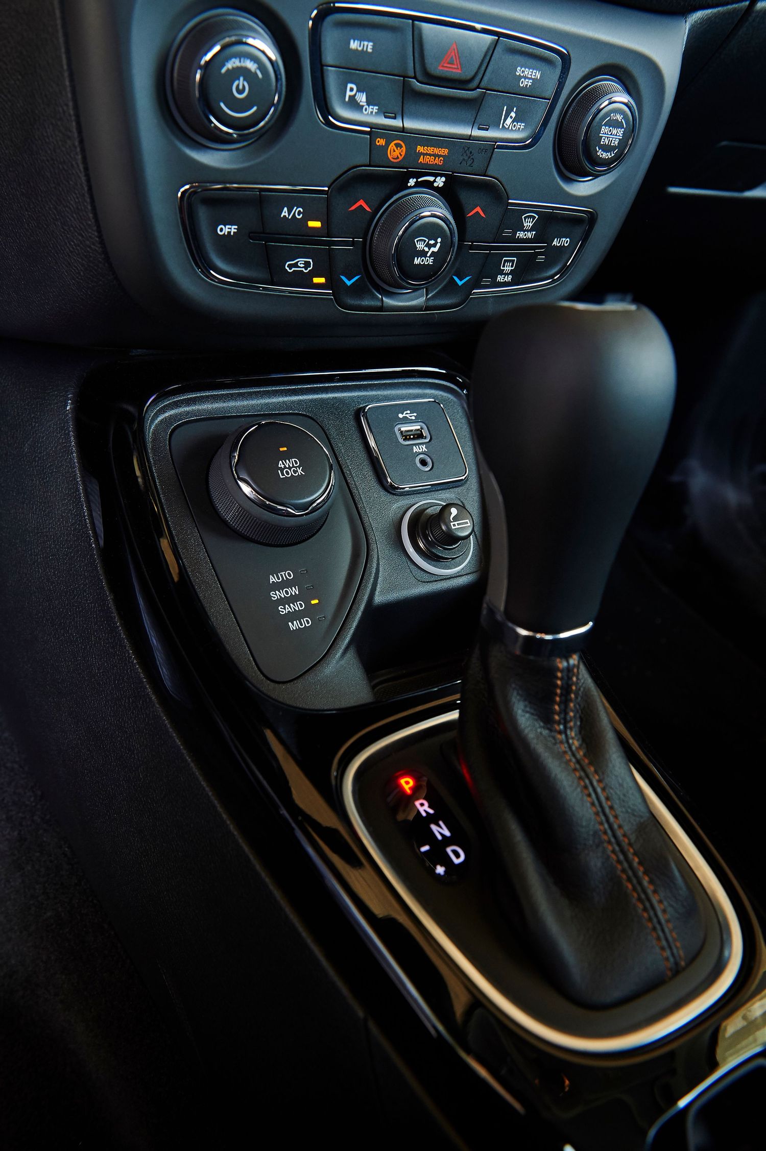 Close-up shots of Jeep's automatic transmission gear selector and climate controls.