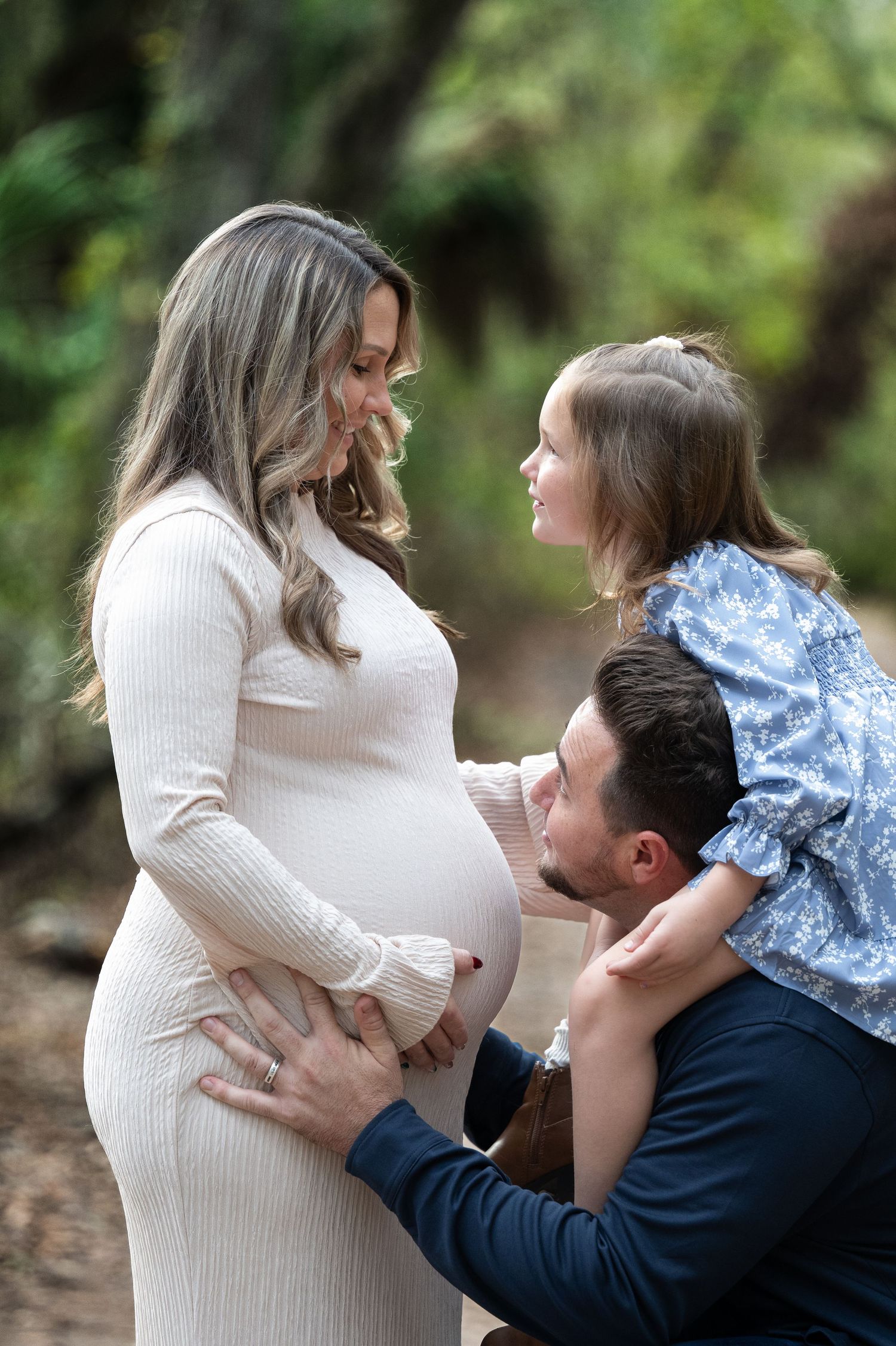 A maternity photo sequence shows a couple sharing tender moments in an outdoor setting with natural greenery.