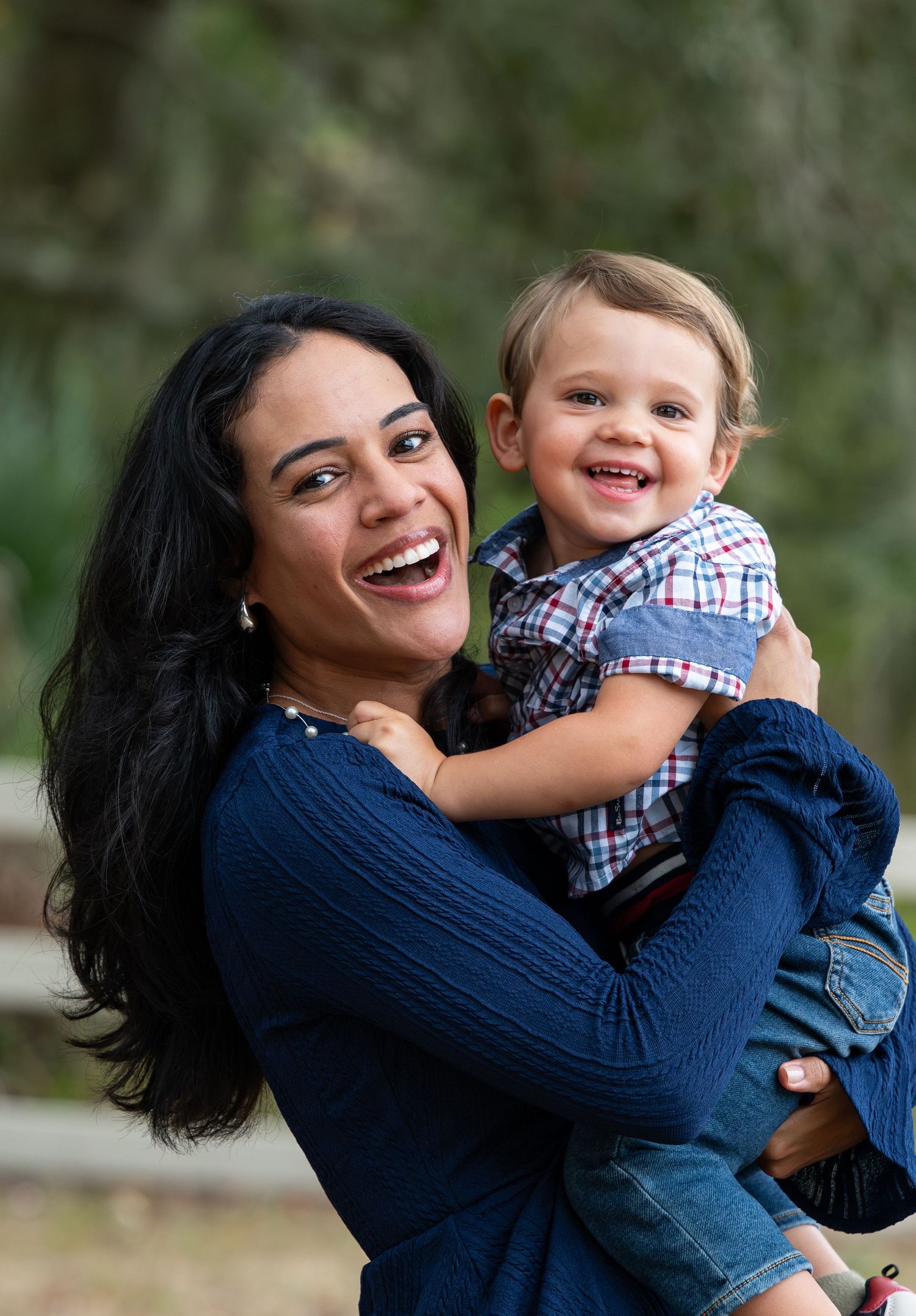 A heartwarming sequence of candid moments showing playful interaction and joyful laughter between parent and child outdoors.