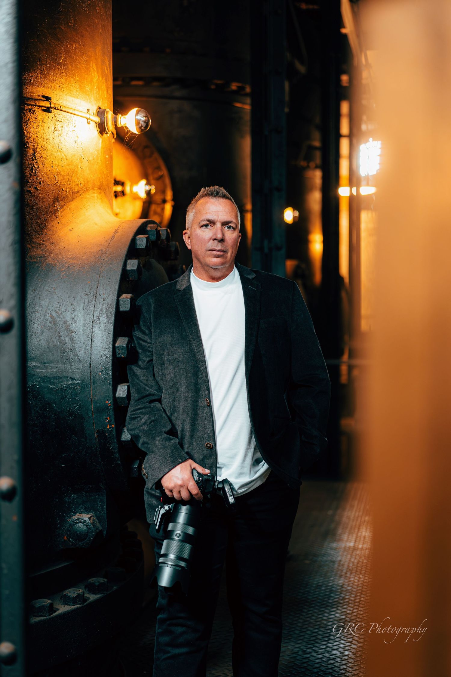 Dramatic portrait sequence of person in white shirt and dark jacket against moody corridor with warm lighting.