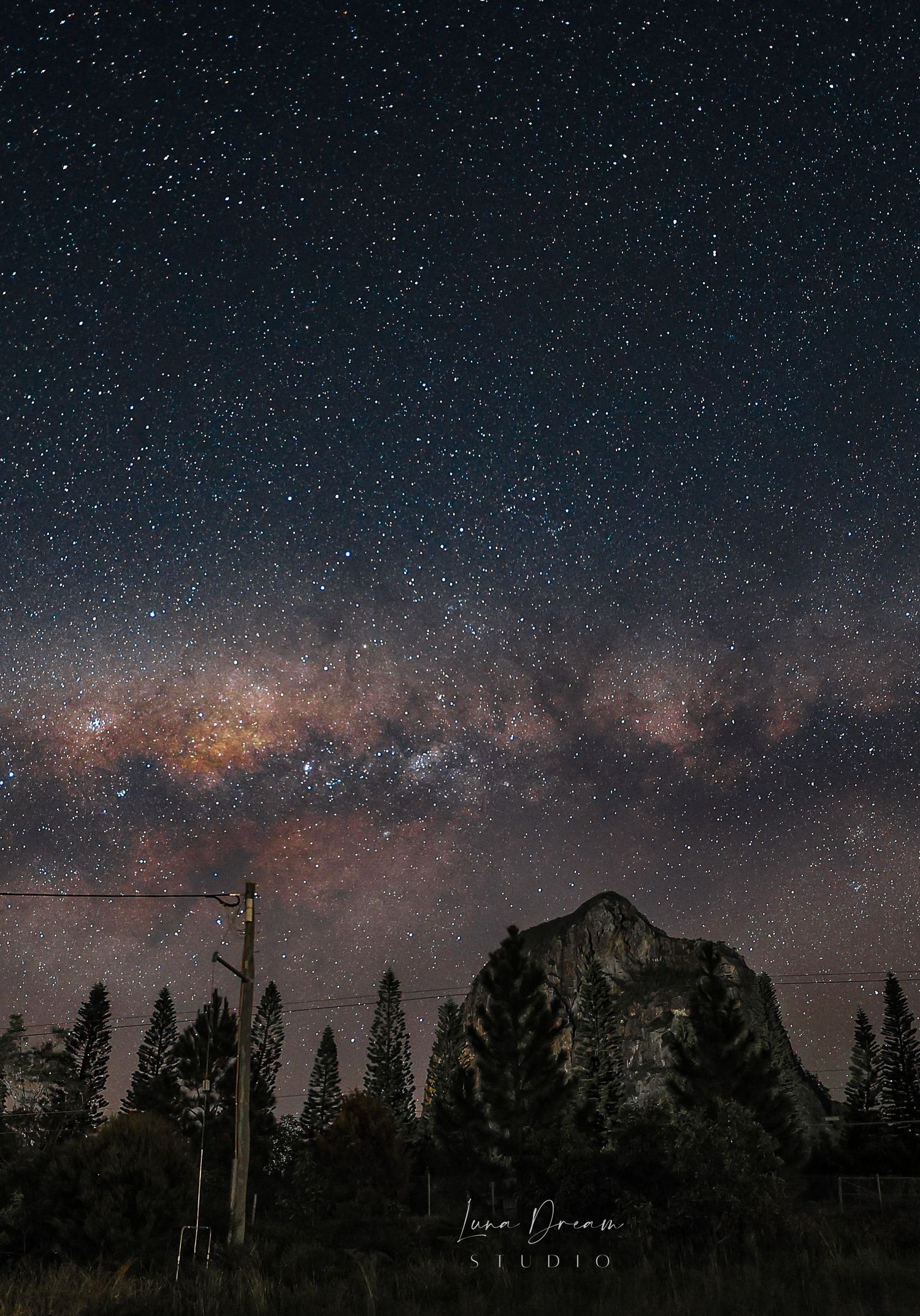 Mt Tibrogargan, Glass House Mountains Queensland. A rugged mountain peak beneath the Milky Way.