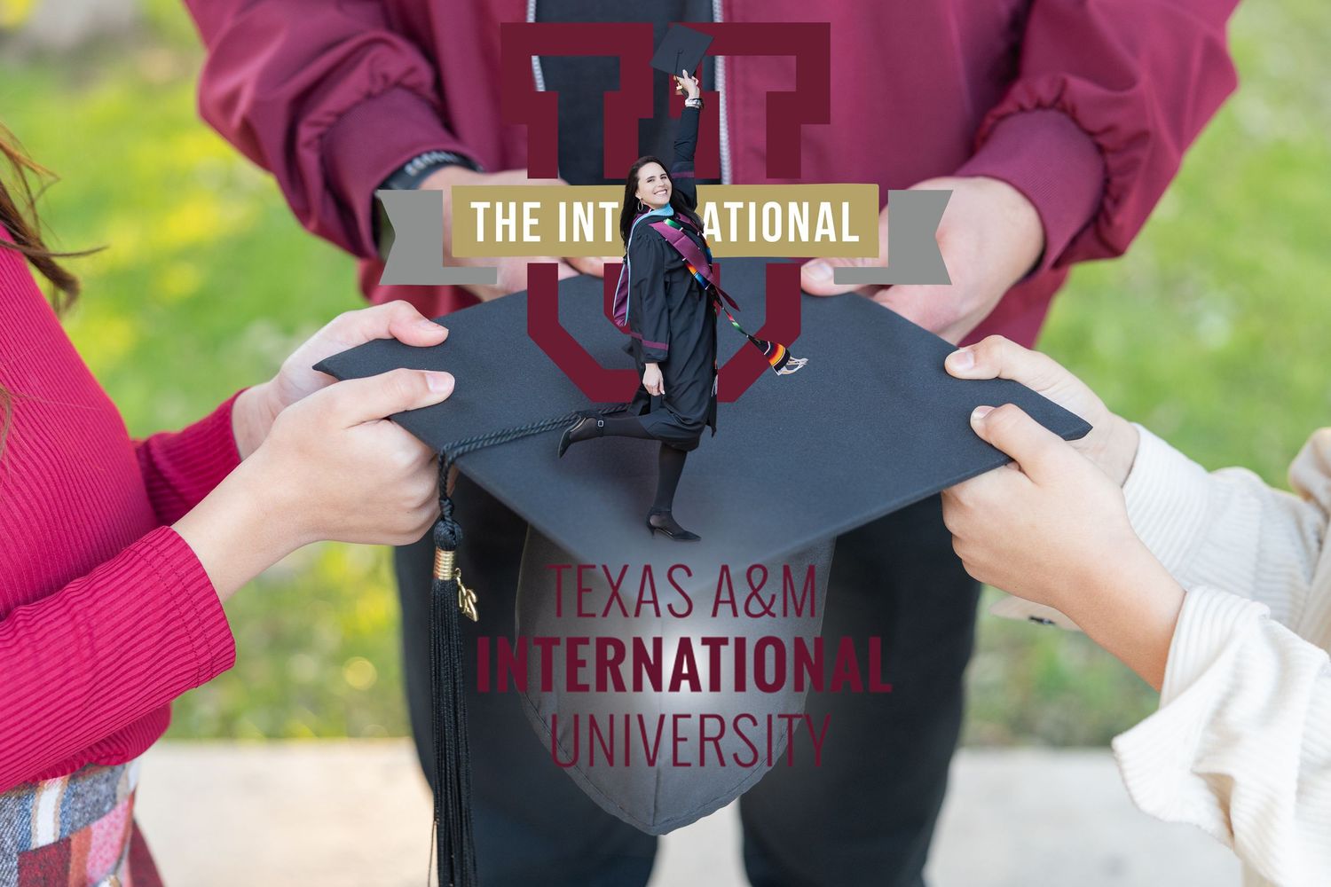 A person in a maroon Texas A&M International University sweatshirt stands outdoors on a sunny day.
