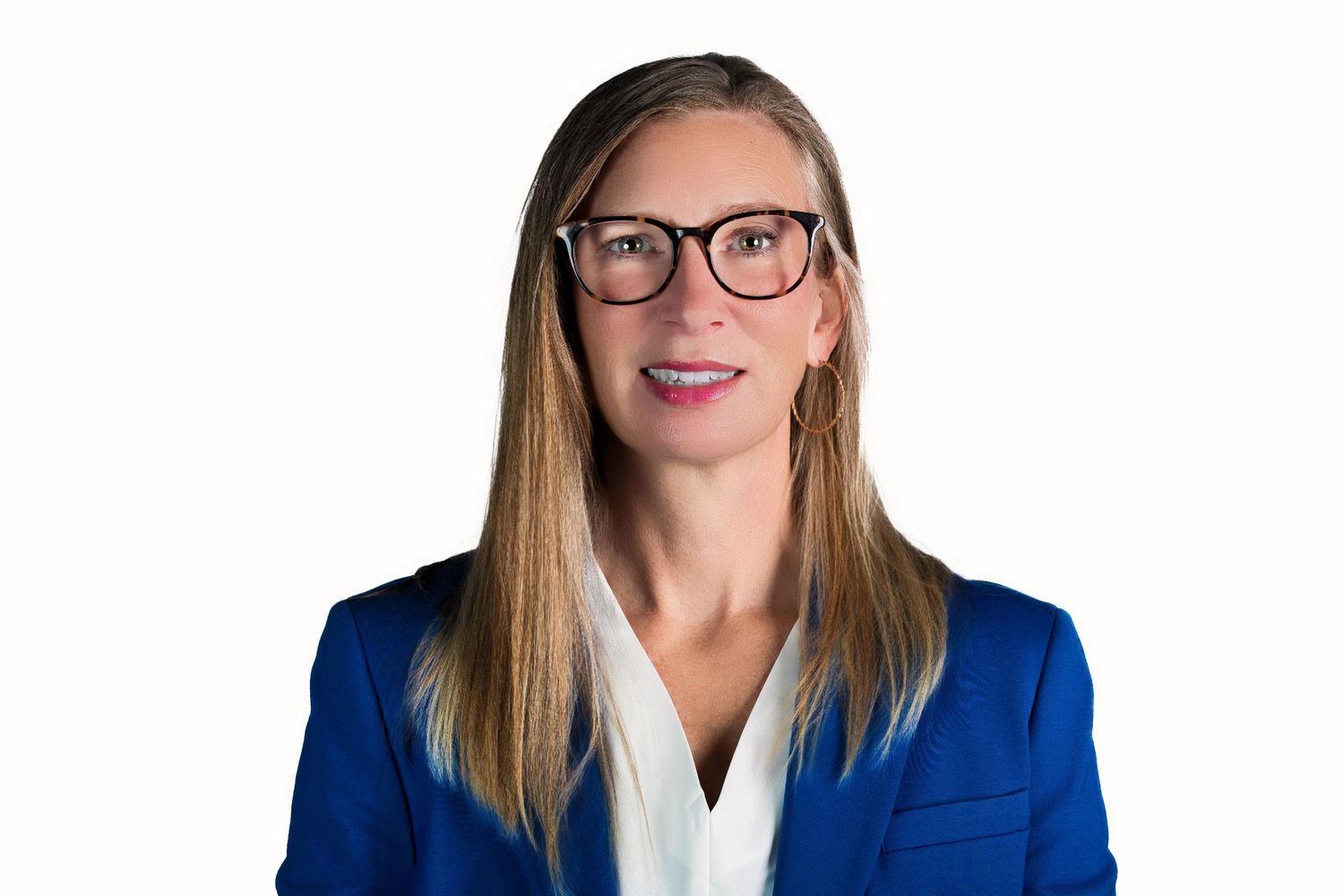 Professional headshot of someone wearing glasses, a blue blazer and white blouse against a white background.