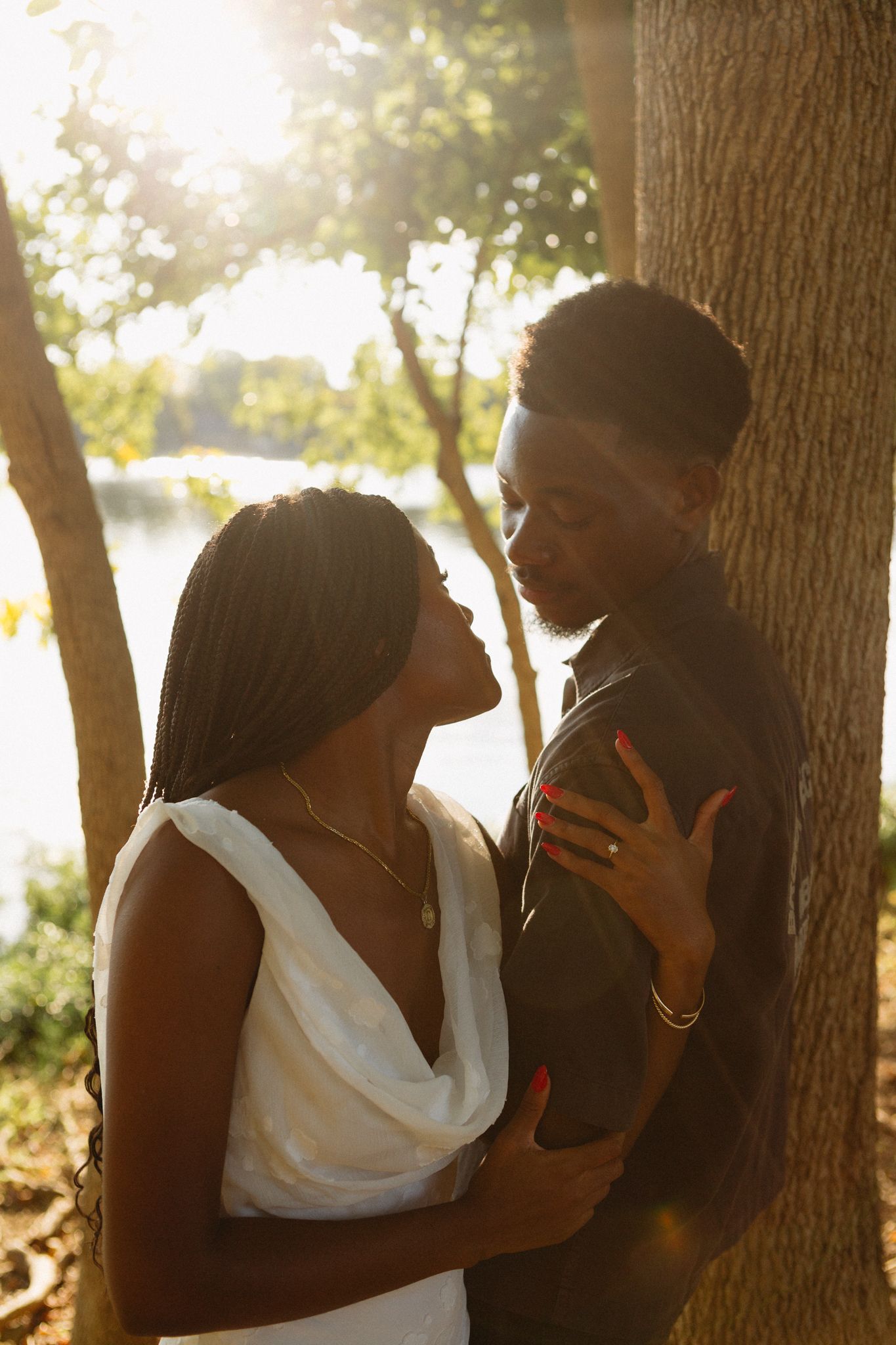 Romantic proposal at a lakeside location in Lexington, Kentucky, with a young Black couple.