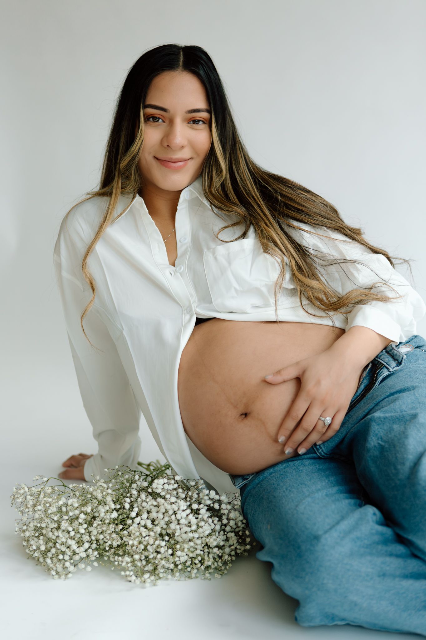 Studio maternity photoshoot with a glowing expectant mother in Louisville, Kentucky. Professional maternity photography