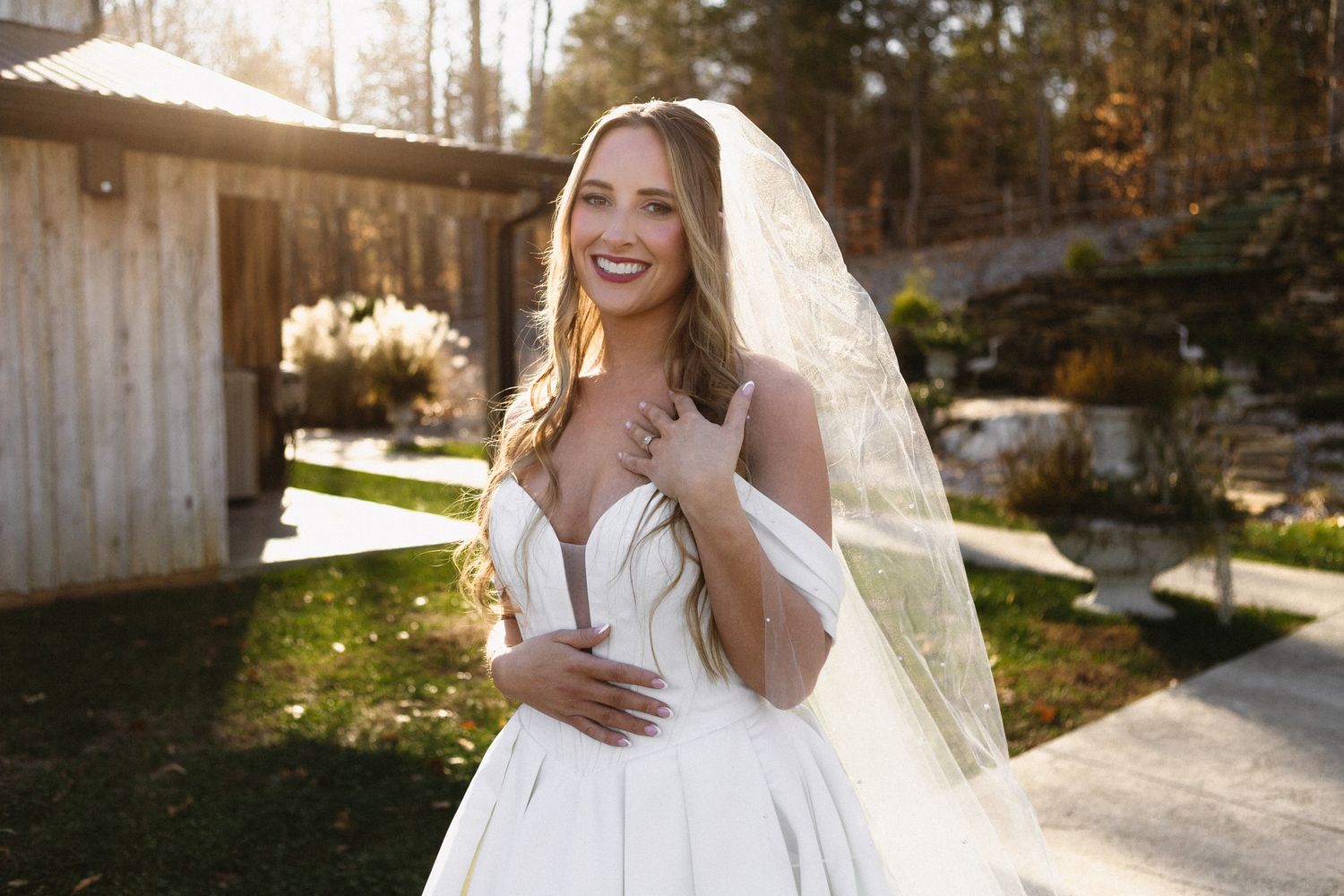 Wedding party celebrates joyfully outdoors during autumn photoshoot.