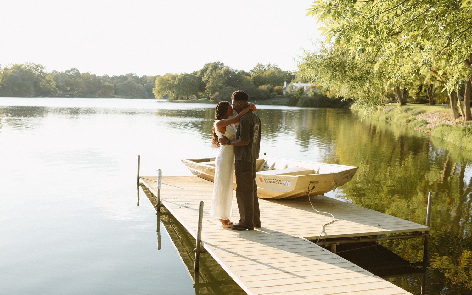 Romantic proposal at a lakeside location in Lexington, Kentucky, with a young Black couple.