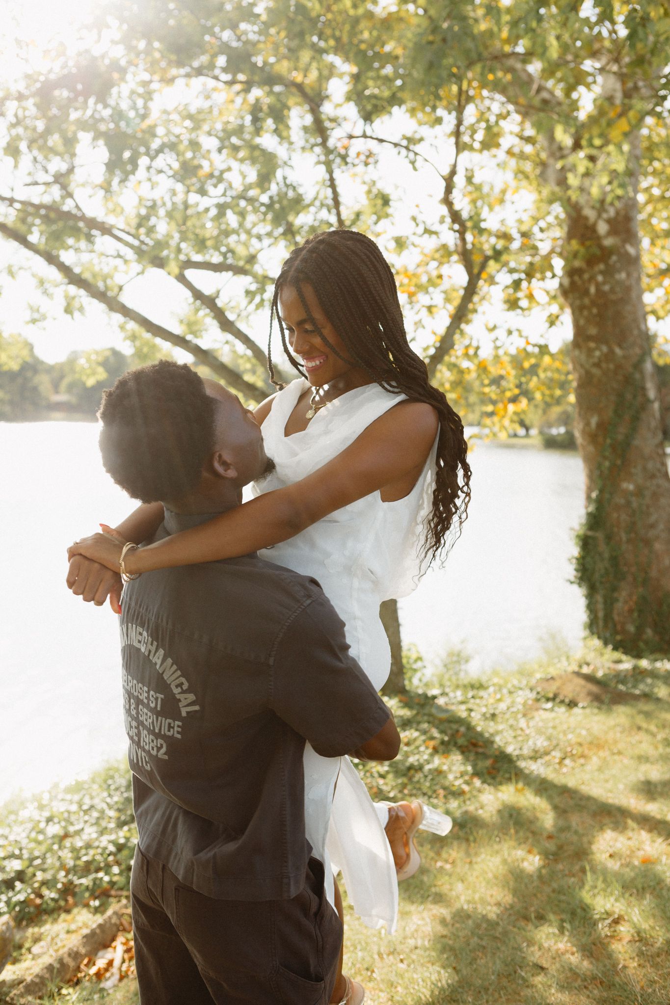 Romantic proposal at a lakeside location in Lexington, Kentucky, with a young Black couple.