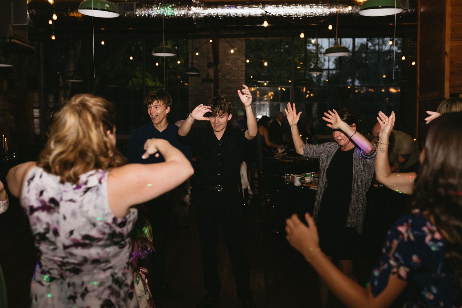 Guests dancing joyfully at a lively wedding reception in Kentucky