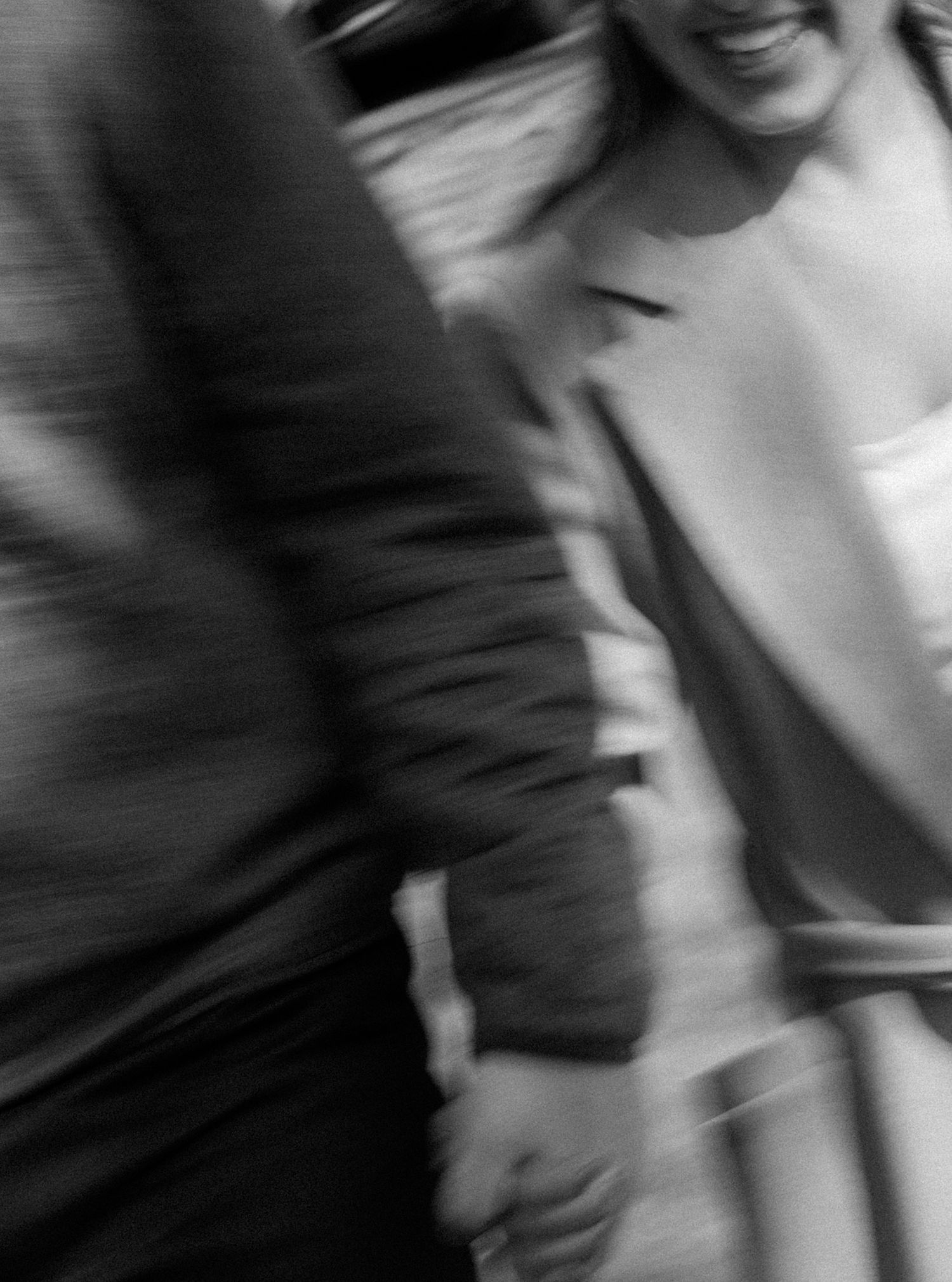 Romantic engagement photo of couple holding hands in Old Louisville's picturesque streets on a cold day