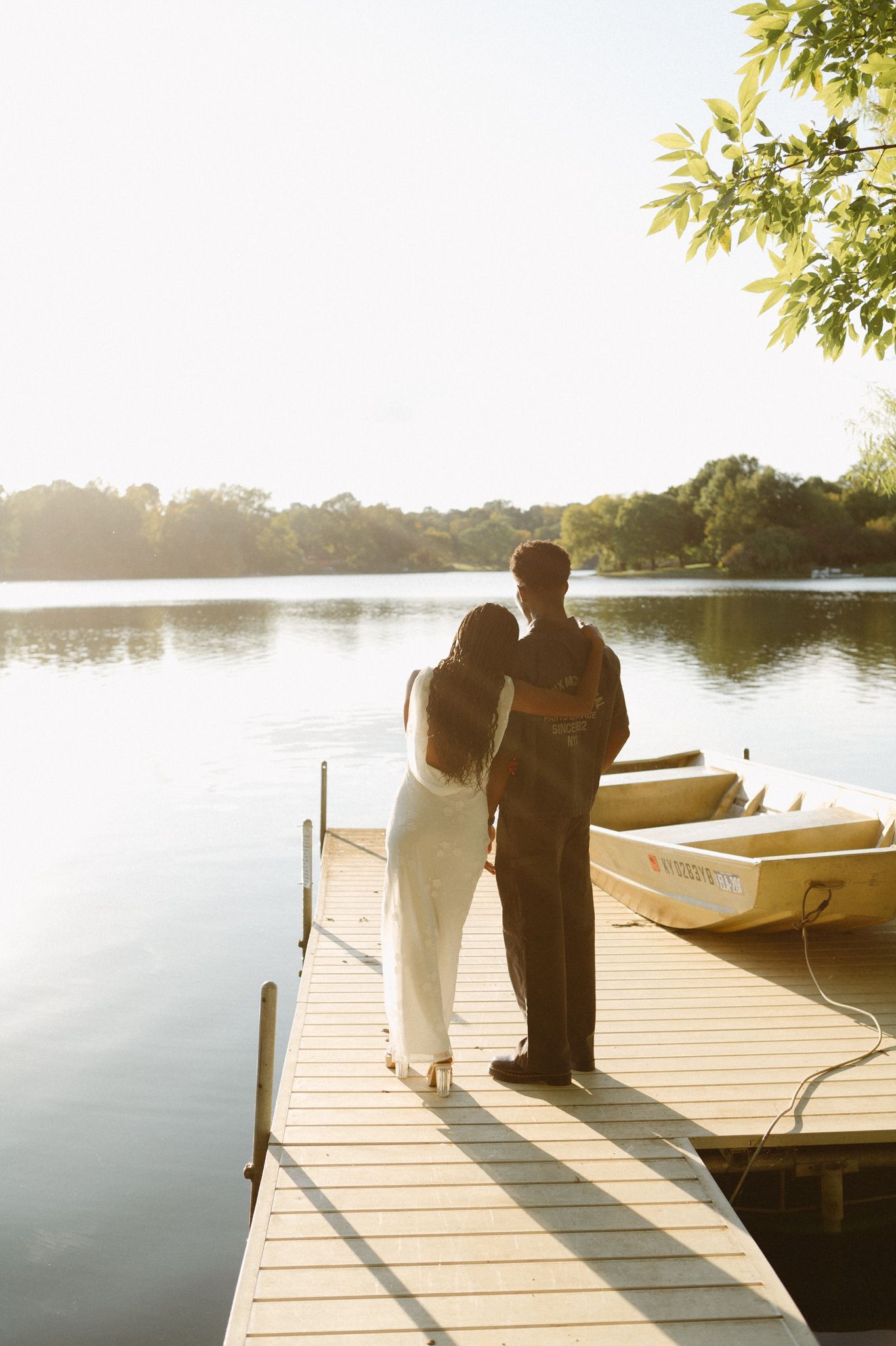 Romantic proposal at a lakeside location in Lexington, Kentucky, with a young Black couple.