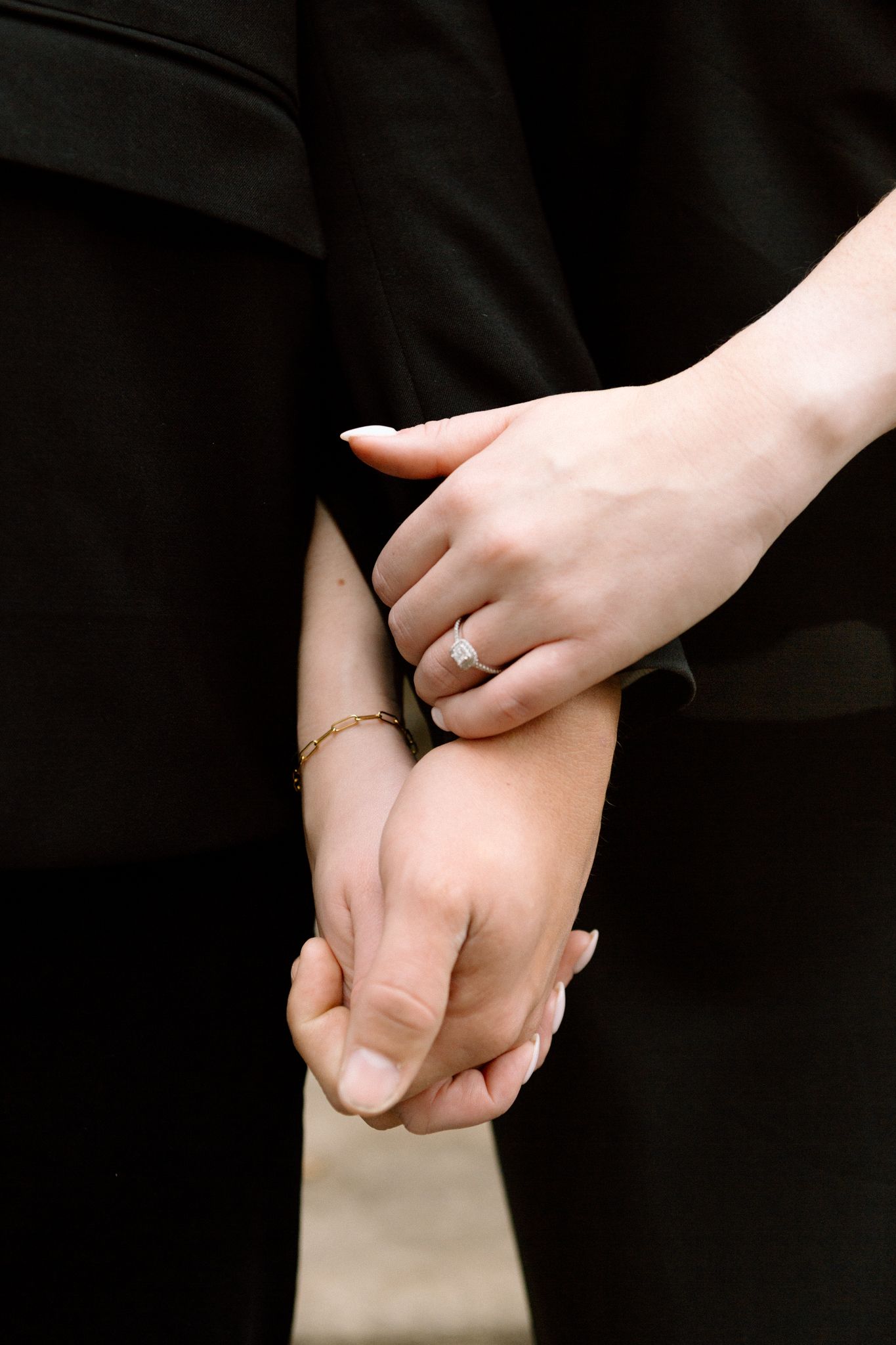 engaged couple holding hands downtown louisville