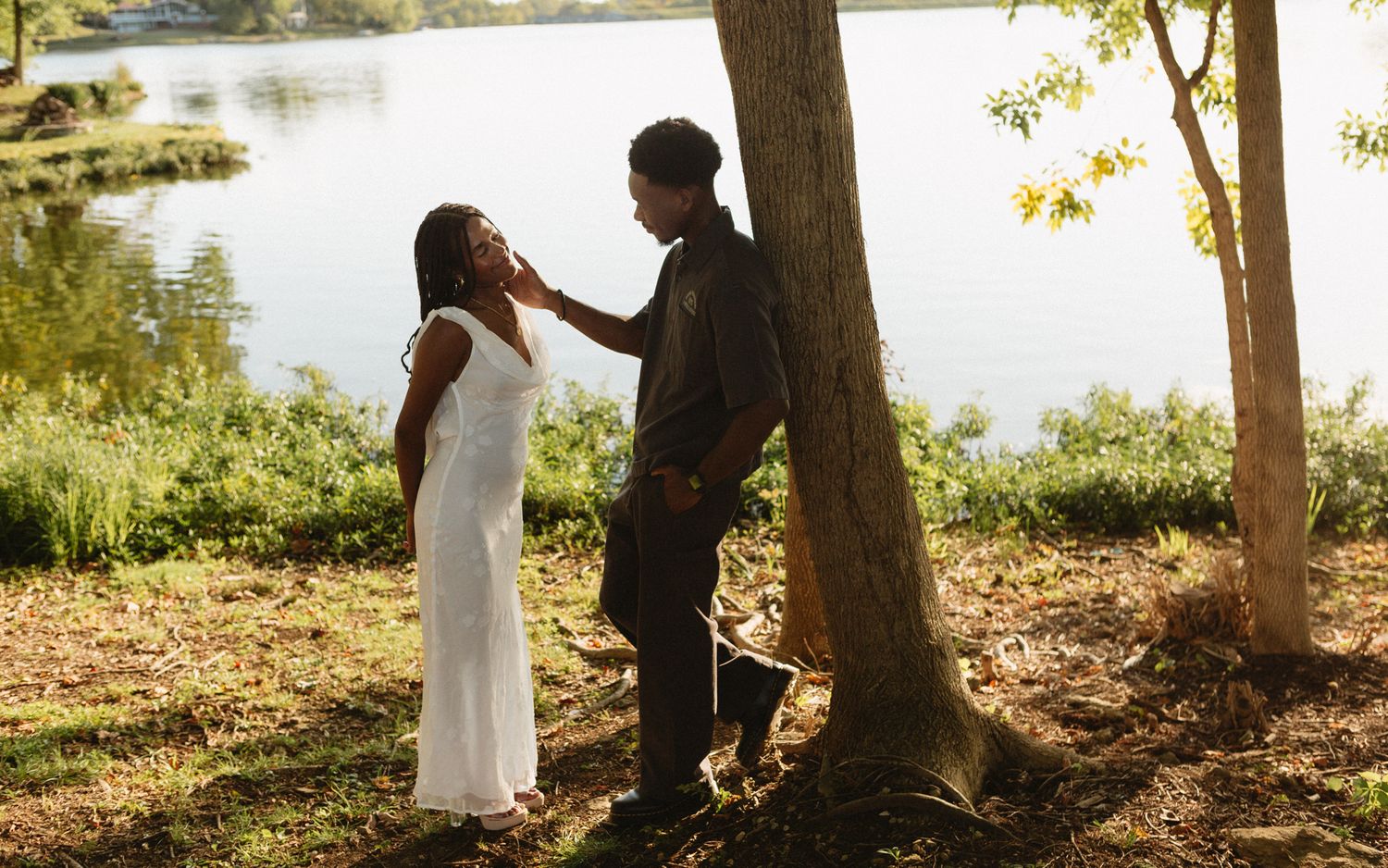 Romantic proposal at a lakeside location in Lexington, Kentucky, with a young Black couple.