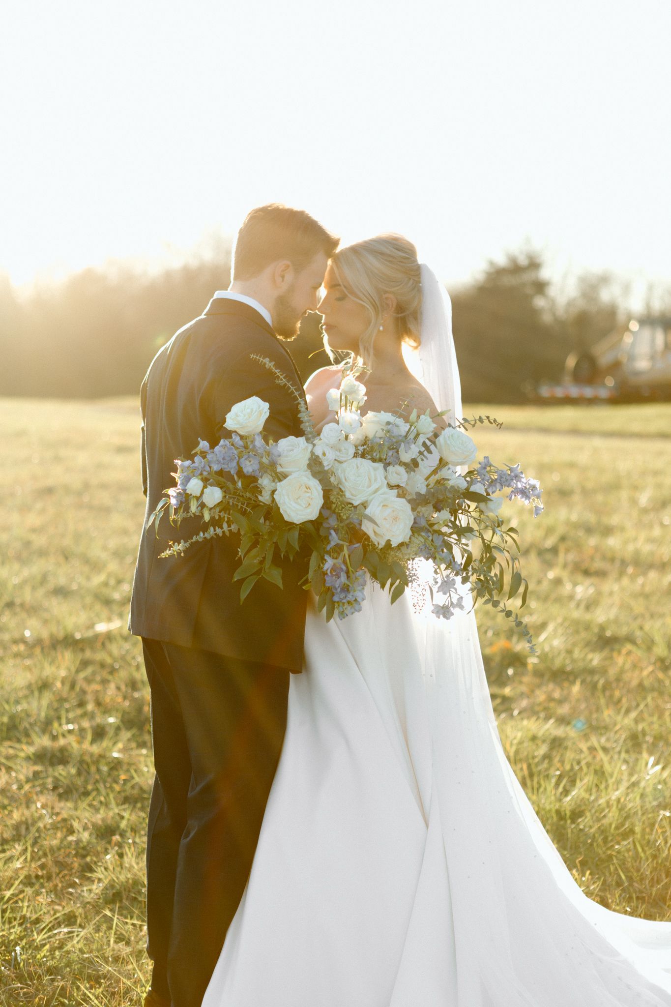 Bride and groom in golden hour light at Silo Farms, Kentucky, capturing a romantic wedding moment