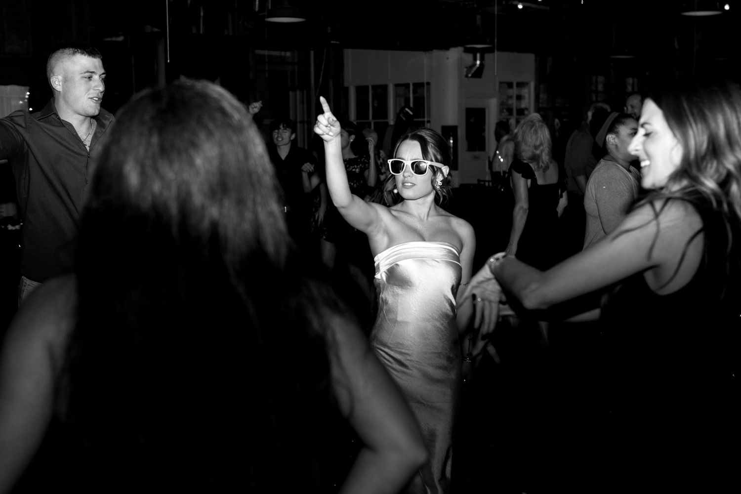 Bride and groom sharing a romantic first dance at an outdoor reception