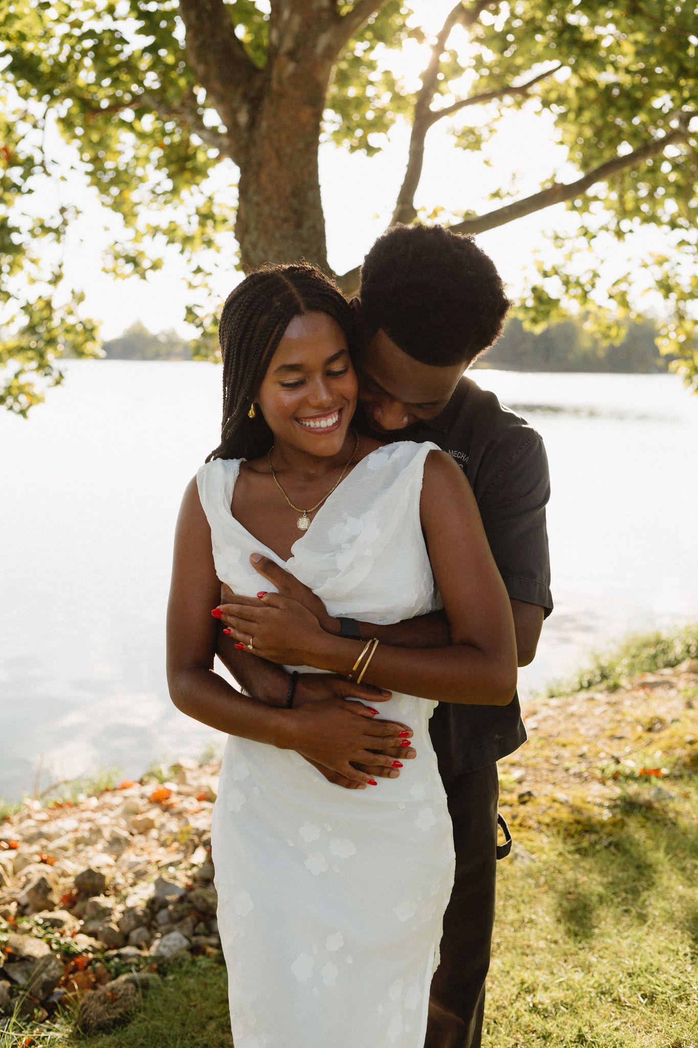 Romantic proposal at a lakeside location in Lexington, Kentucky, with a young Black couple.