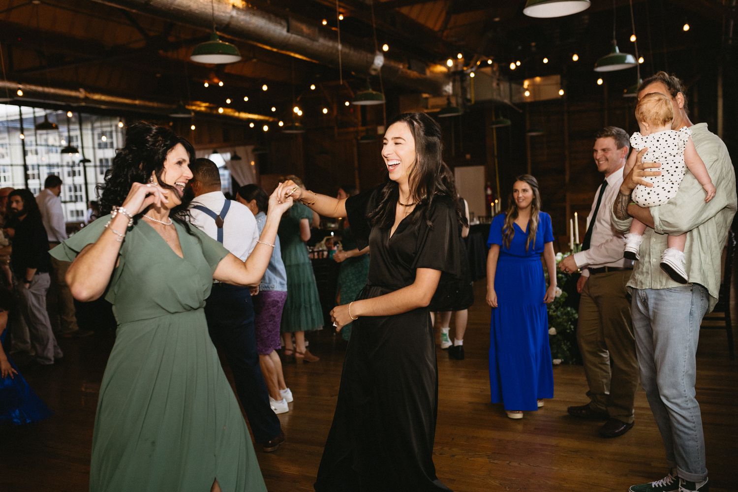 Guests dancing joyfully at a lively wedding reception in Kentucky