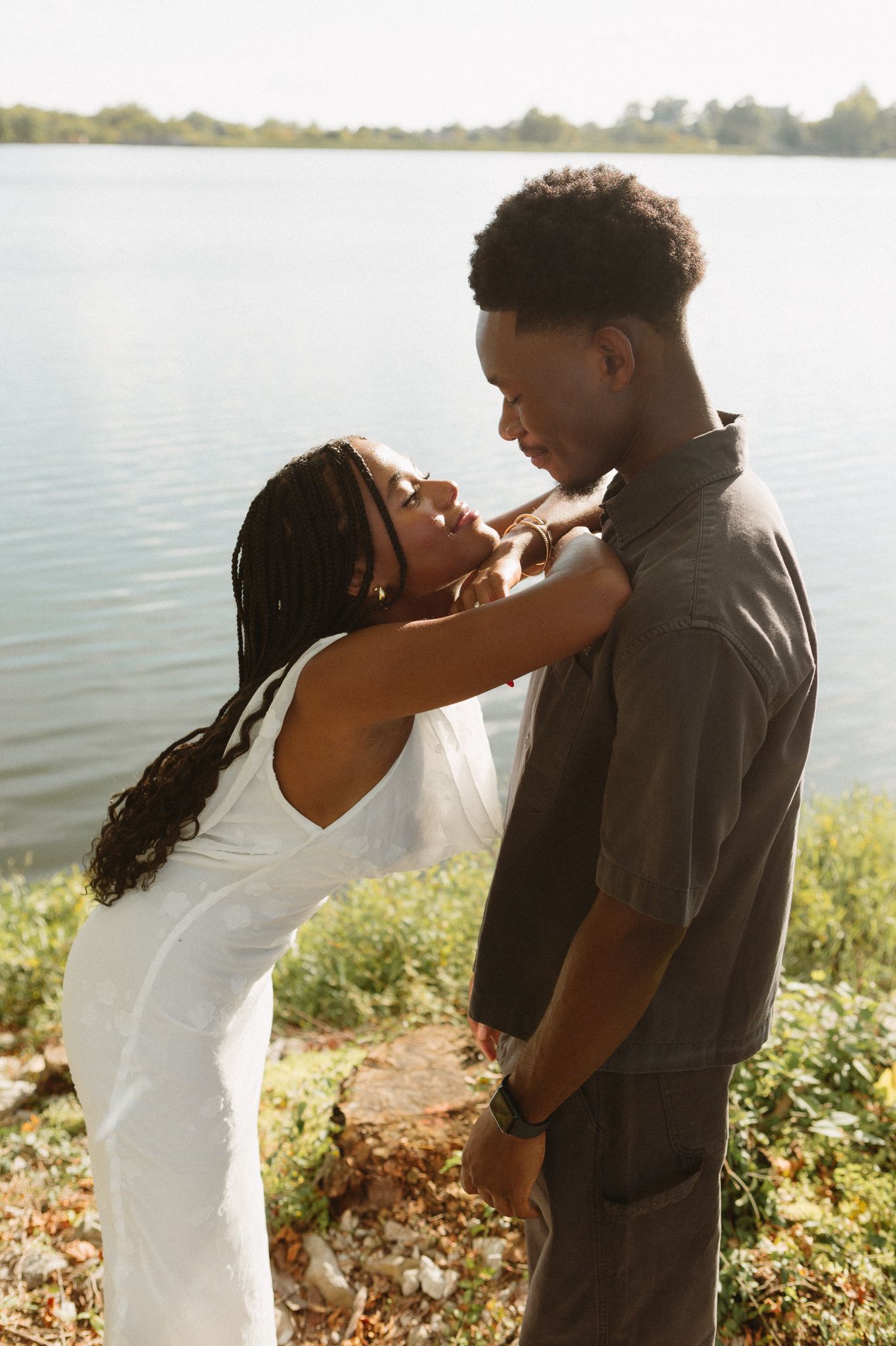 Romantic proposal at a lakeside location in Lexington, Kentucky, with a young Black couple.