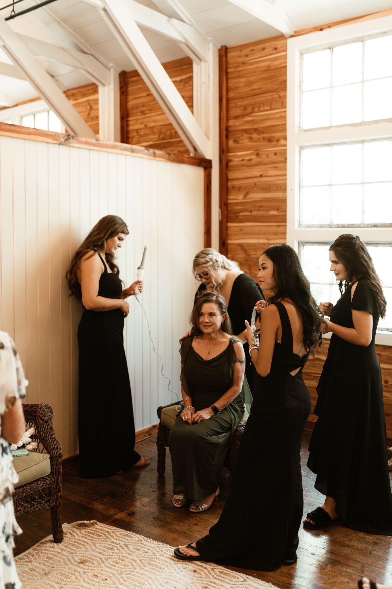 Bridesmaids joyfully preparing for the wedding, surrounded by elegant dresses and excited chatter in a bright, cheerful