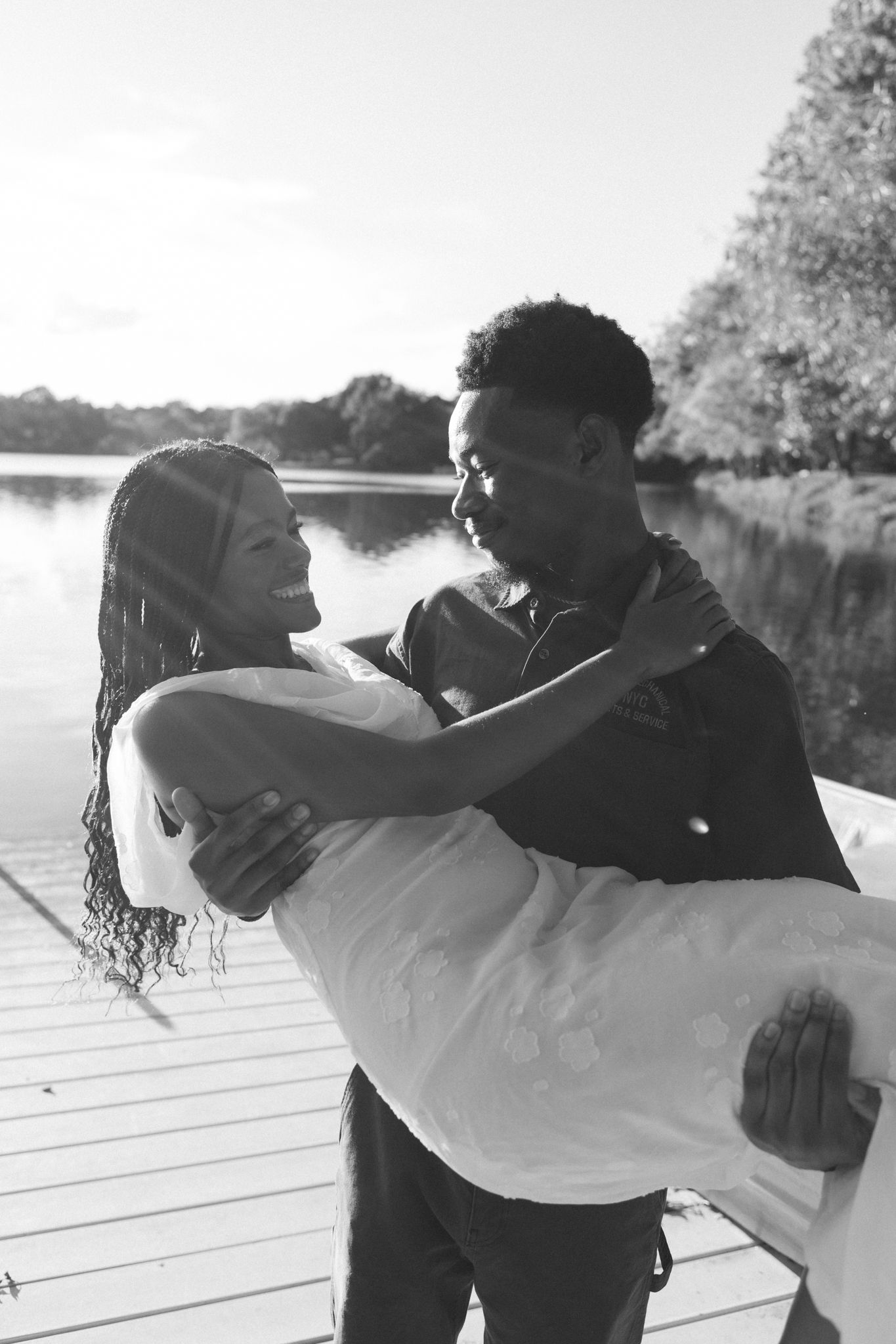 Romantic proposal at a lakeside location in Lexington, Kentucky, with a young Black couple.