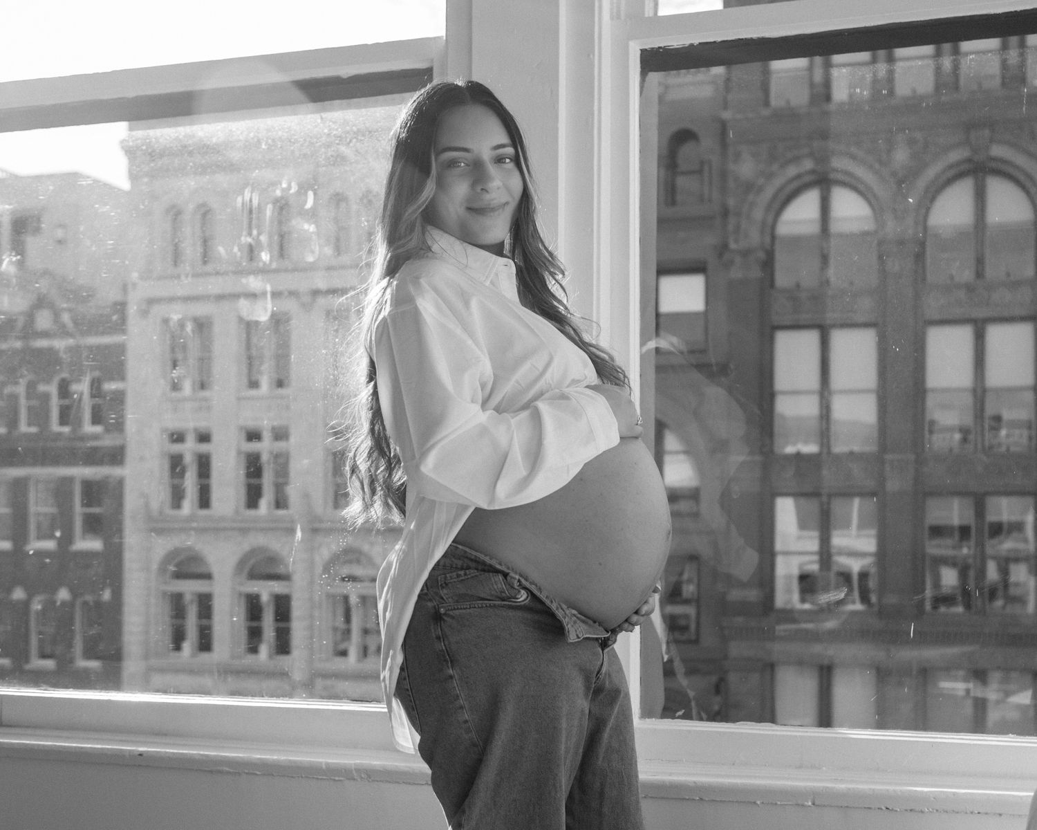 Studio maternity photoshoot with a glowing expectant mother in Louisville, Kentucky. Professional maternity photography