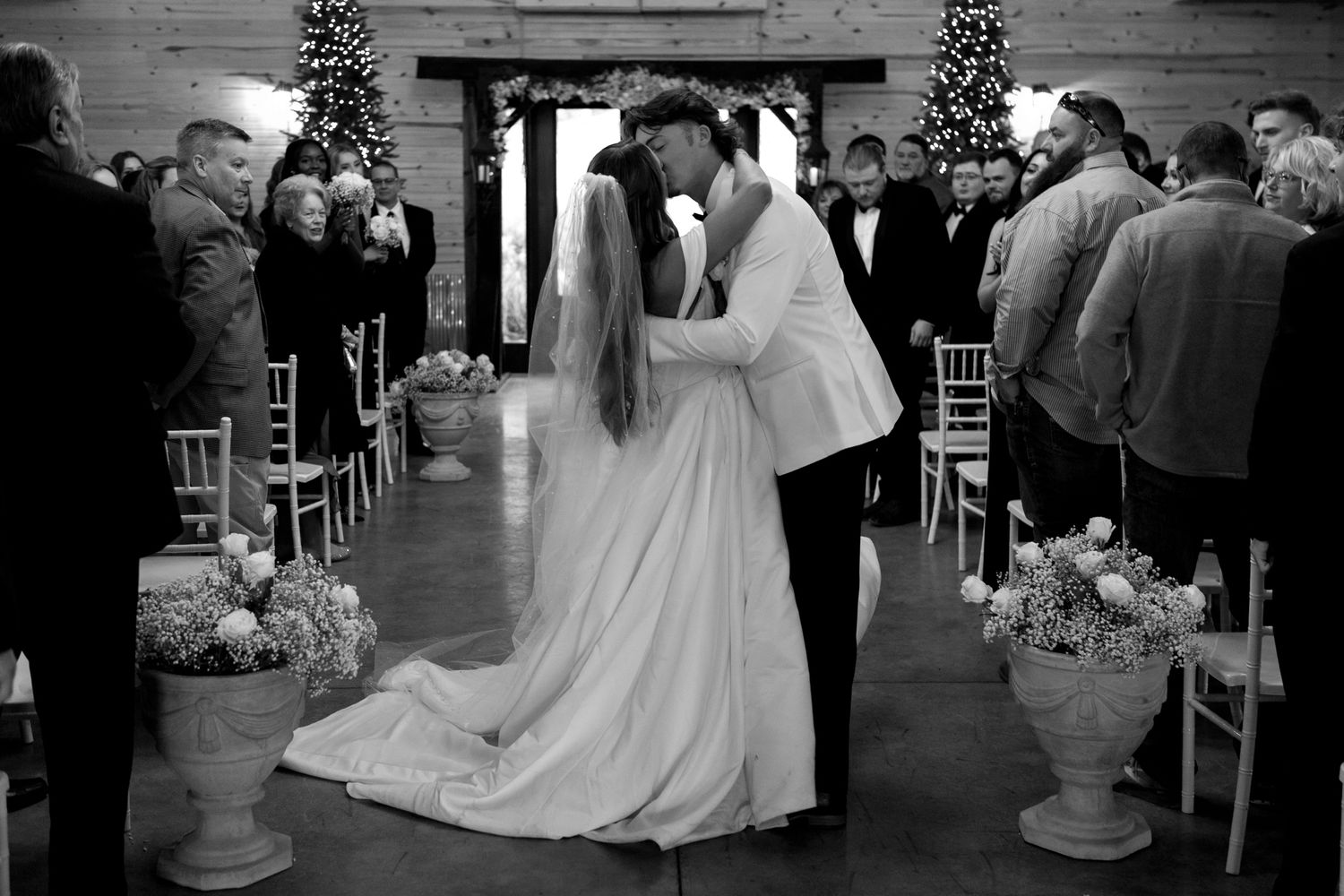 A series of elegant wedding reception scenes decorated with Christmas trees and lights for a winter celebration.