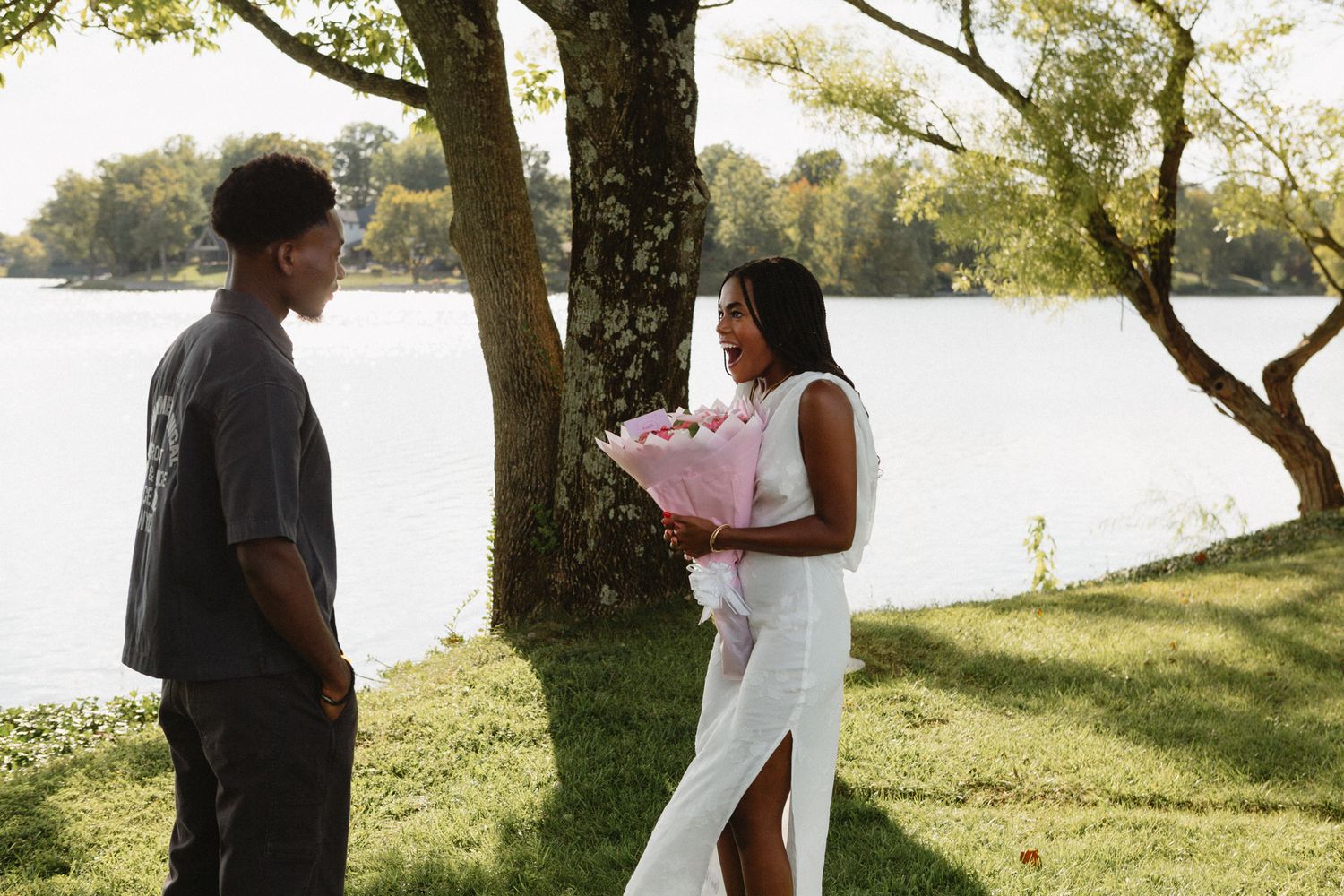 Chadrack proposing to Belle with a bouquet of flowers at their favorite Bible study spot in Lexington.