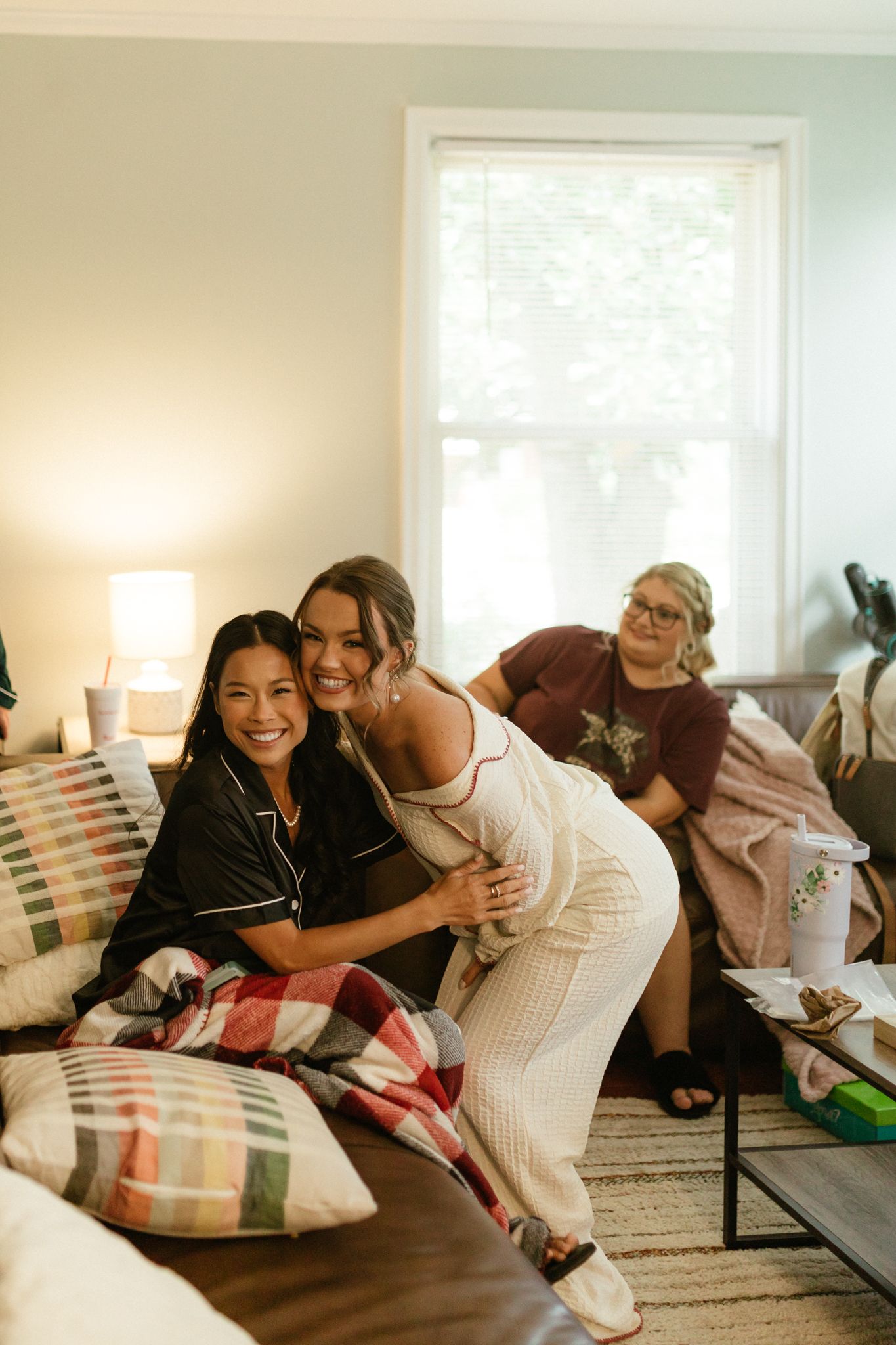 A woman in white pajama pants, embodying a casual and comfortable style in a serene environment