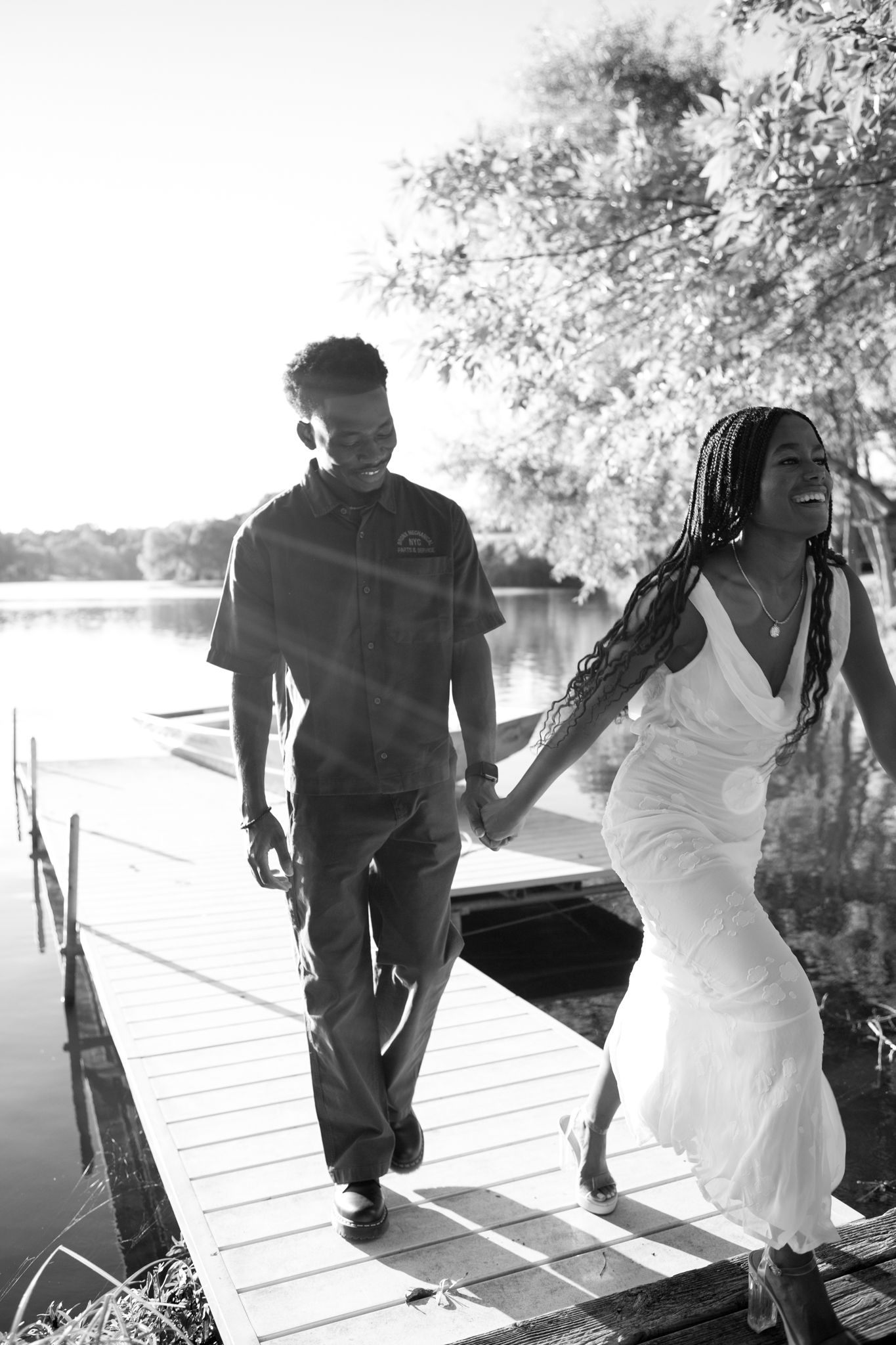 Romantic proposal at a lakeside location in Lexington, Kentucky, with a young Black couple.
