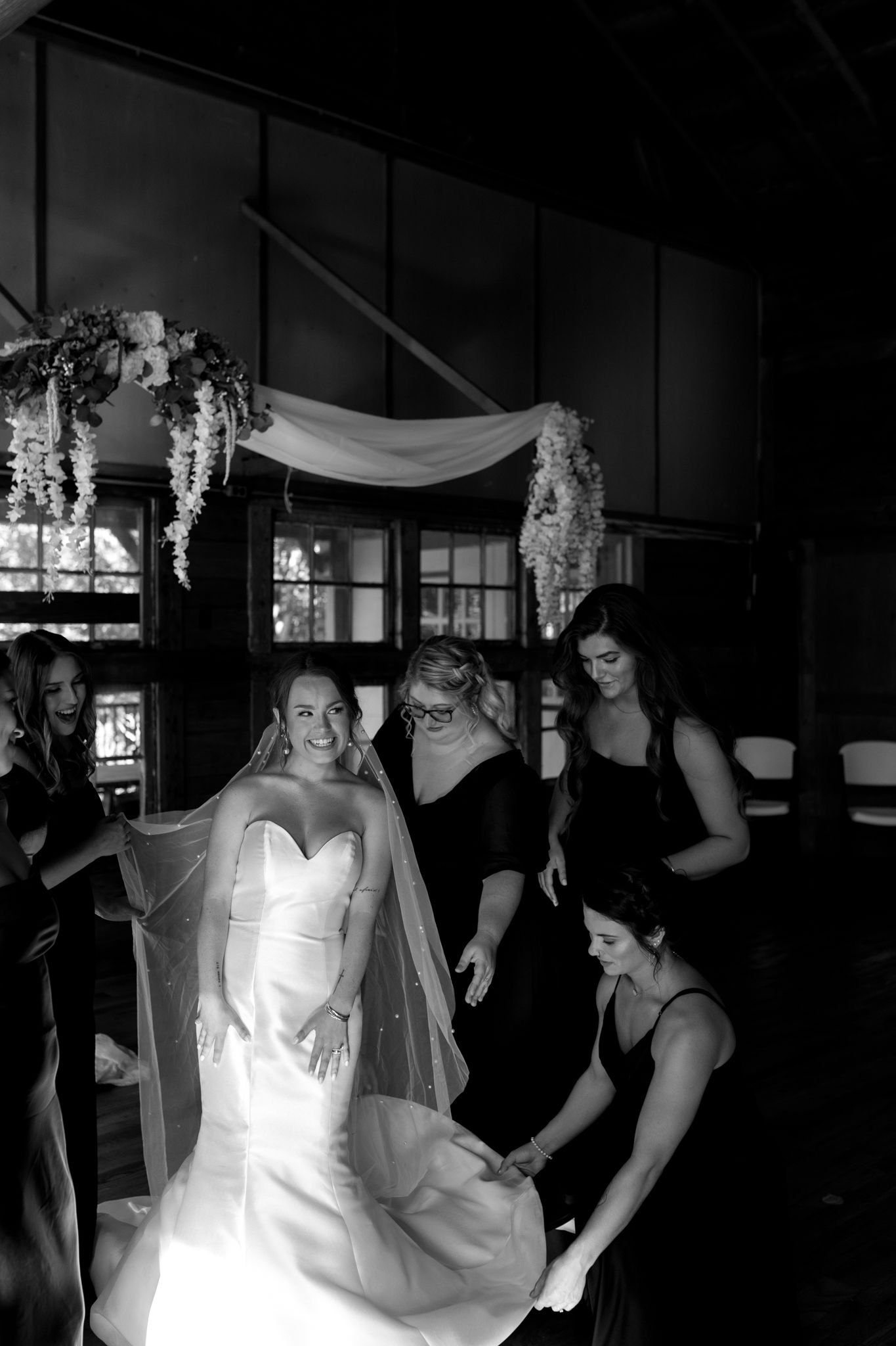 bride and bridesmaid getting ready before wedding ceremony together