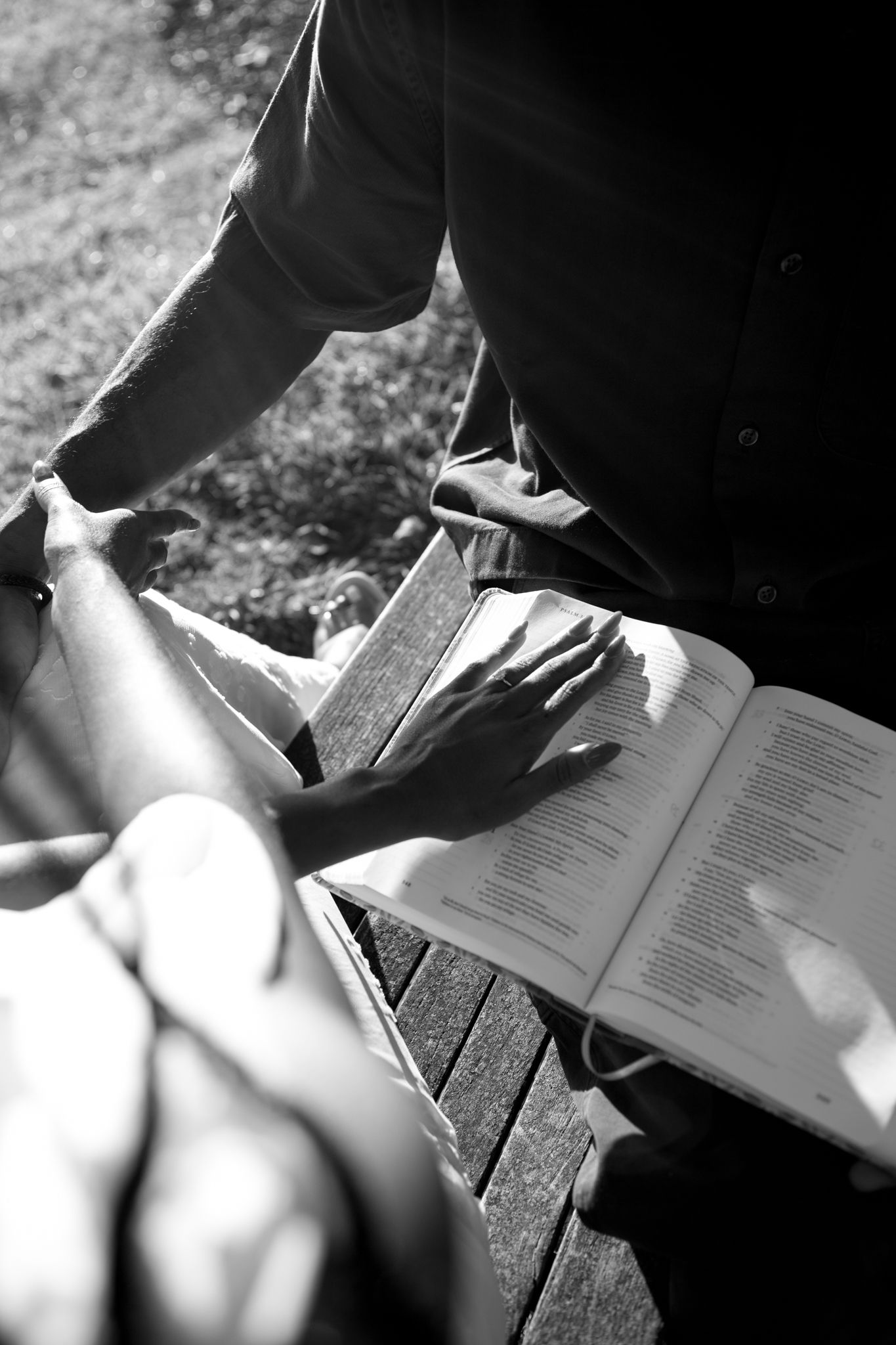 Romantic proposal at a lakeside location in Lexington, Kentucky, with a young Black couple.