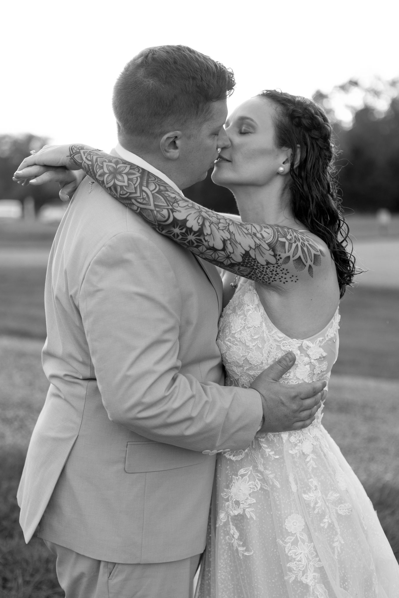 Black and white romantic wedding portraits showing intimate moments between newlyweds.