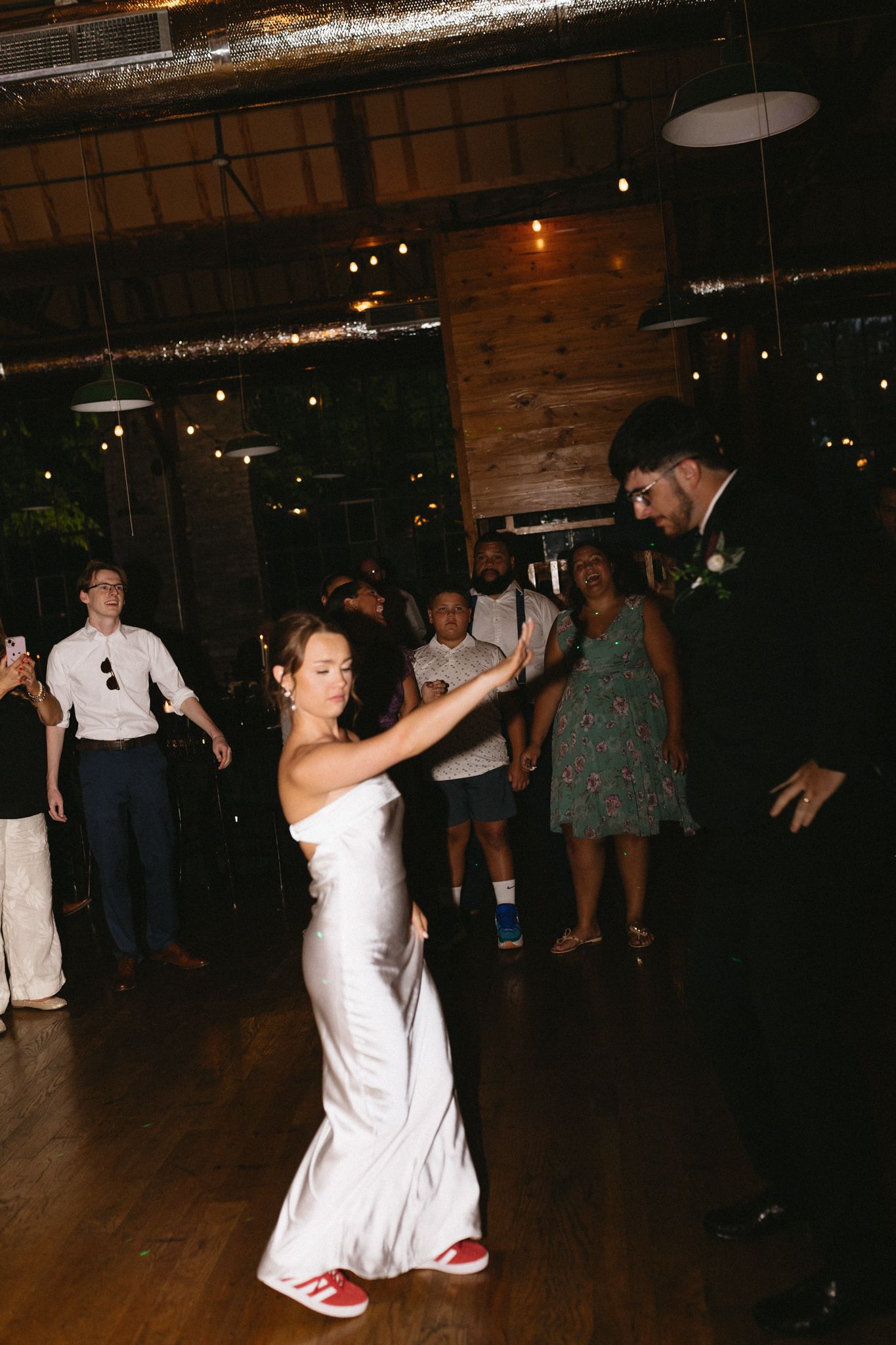 Bride and groom sharing a romantic first dance at an outdoor reception
