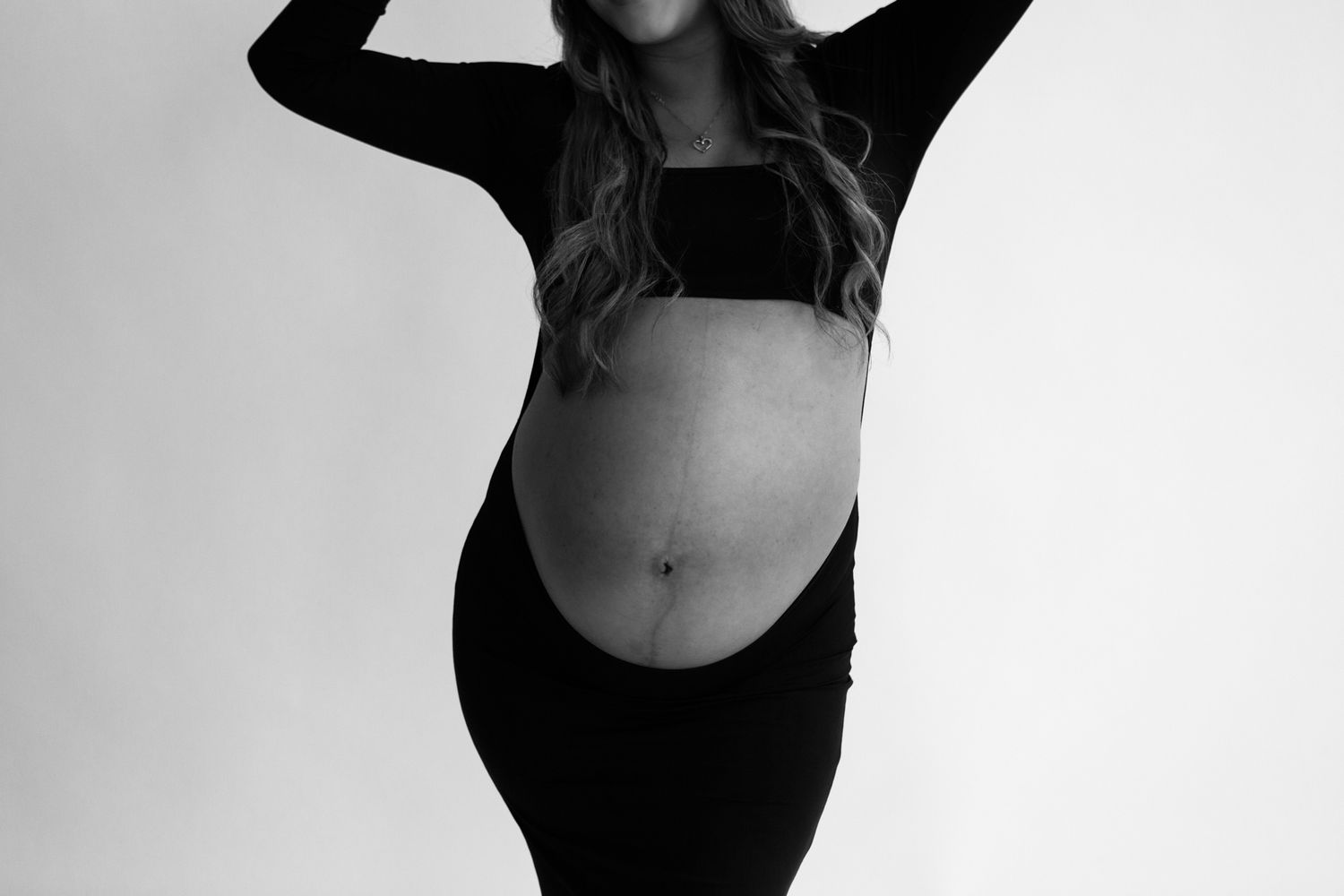 Studio maternity photoshoot with a glowing expectant mother in Louisville, Kentucky. Professional maternity photography