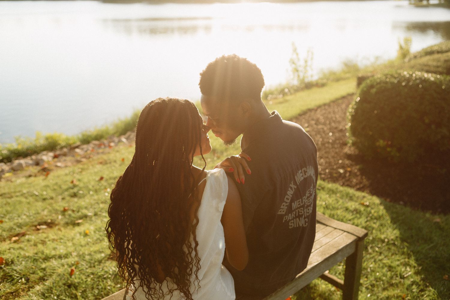 Romantic proposal at a lakeside location in Lexington, Kentucky, with a young Black couple.