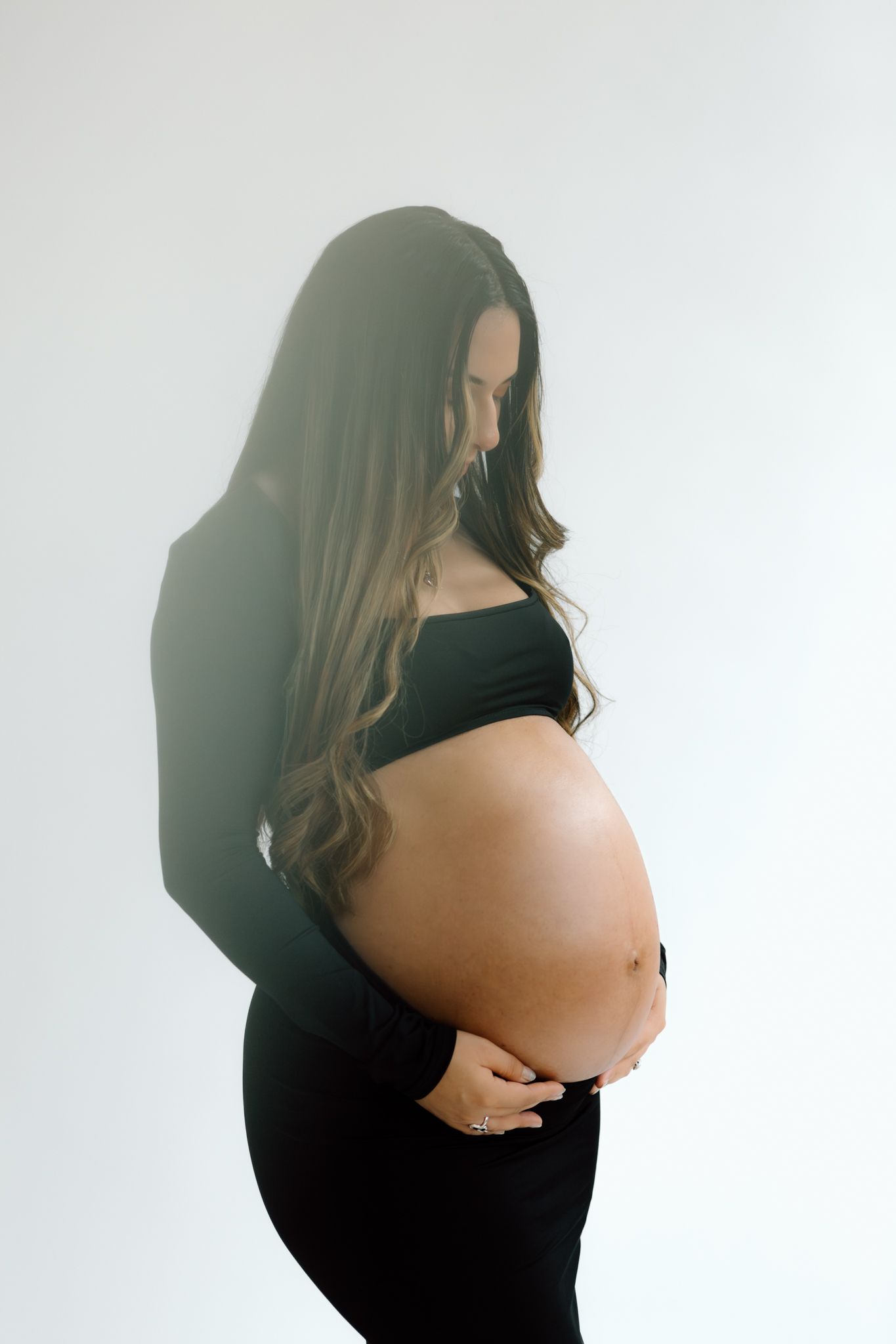 Studio maternity photoshoot with a glowing expectant mother in Louisville, Kentucky. Professional maternity photography