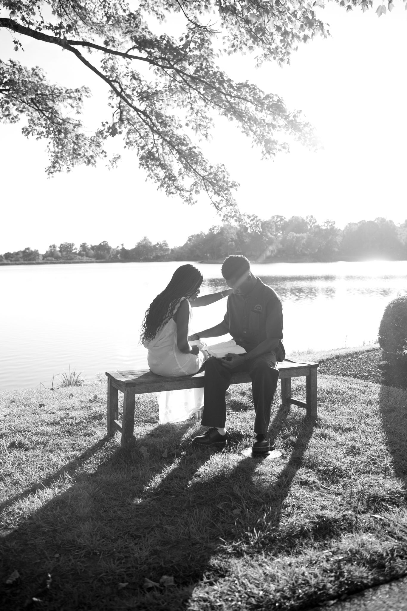 Romantic proposal at a lakeside location in Lexington, Kentucky, with a young Black couple.