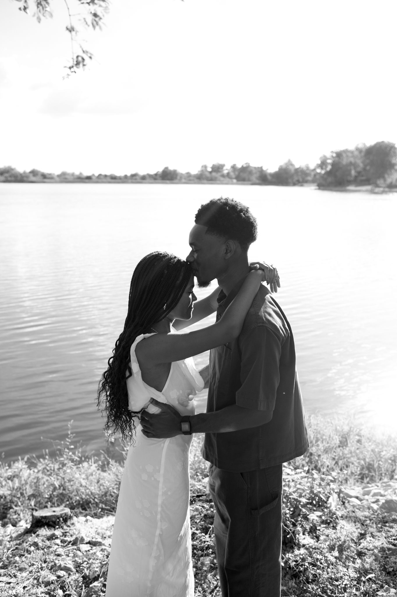 Romantic proposal at a lakeside location in Lexington, Kentucky, with a young Black couple.