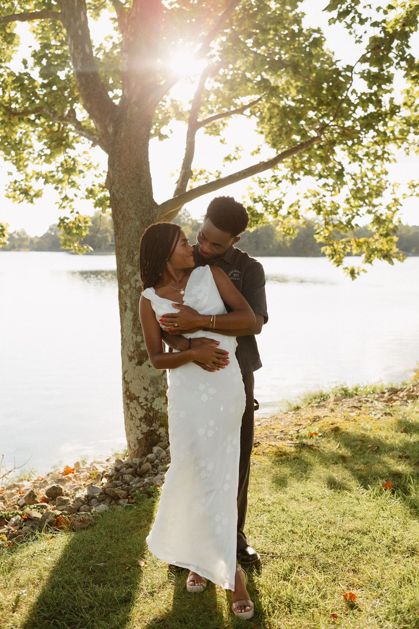 Romantic proposal at a lakeside location in Lexington, Kentucky, with a young Black couple.