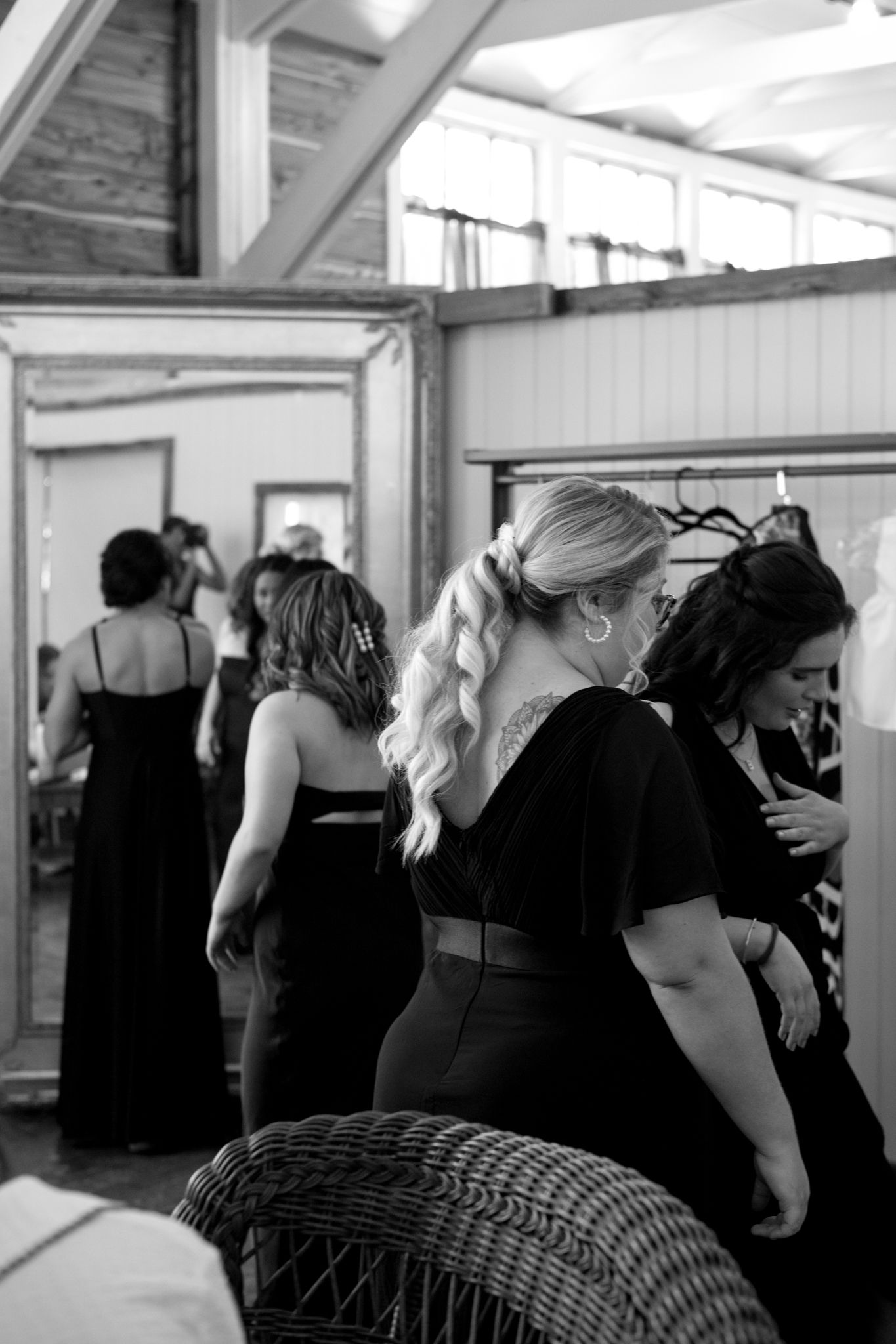 Bridesmaids joyfully preparing for the wedding, surrounded by elegant dresses and excited chatter in a bright, cheerful