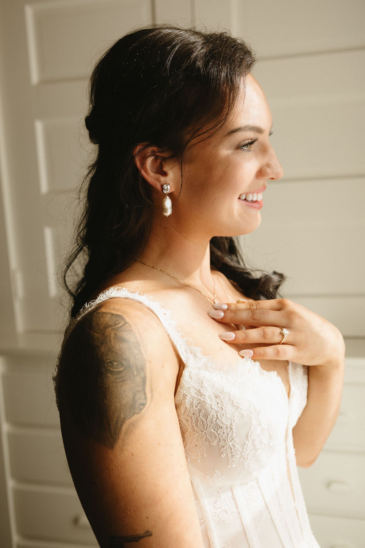 Close-up shots of a bride in lace dress showing delicate details and jewelry.