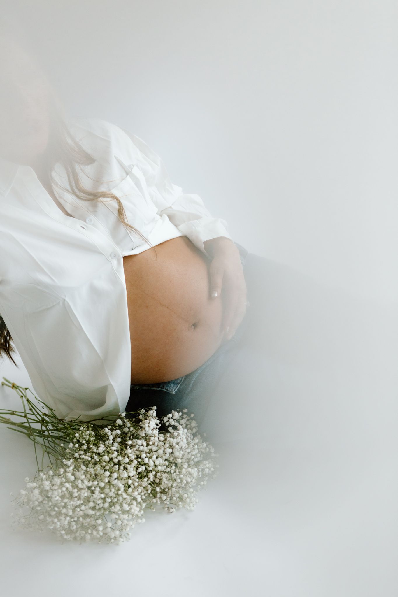Studio maternity photoshoot with a glowing expectant mother in Louisville, Kentucky. Professional maternity photography