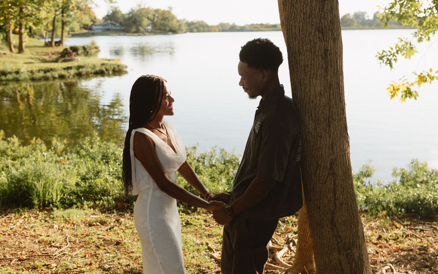 Romantic proposal at a lakeside location in Lexington, Kentucky, with a young Black couple.
