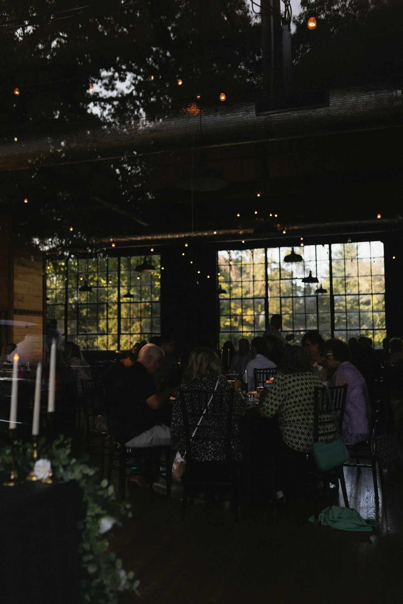 wedding venue cocktail hour through large glass window