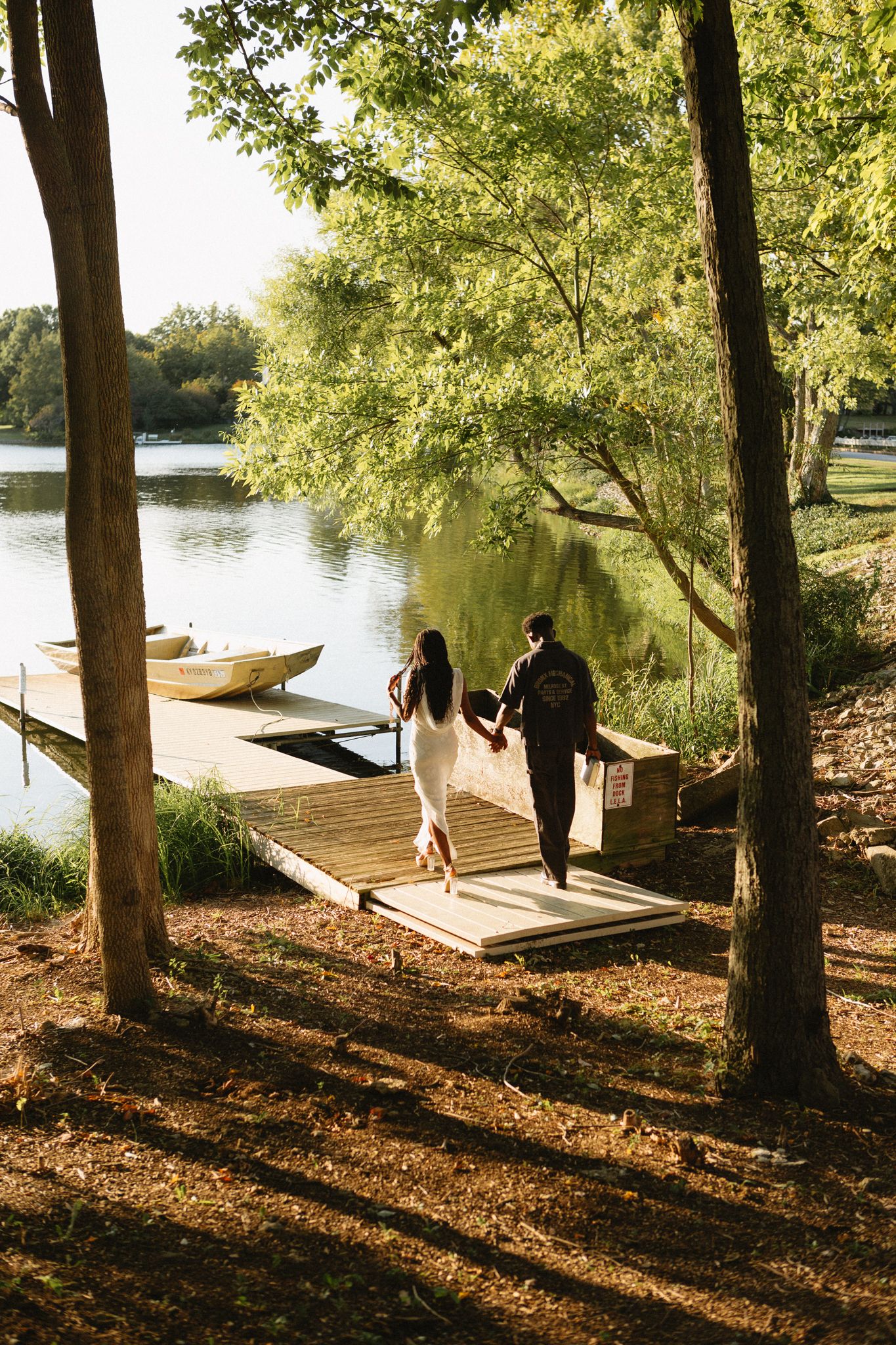 Romantic proposal at a lakeside location in Lexington, Kentucky, with a young Black couple.
