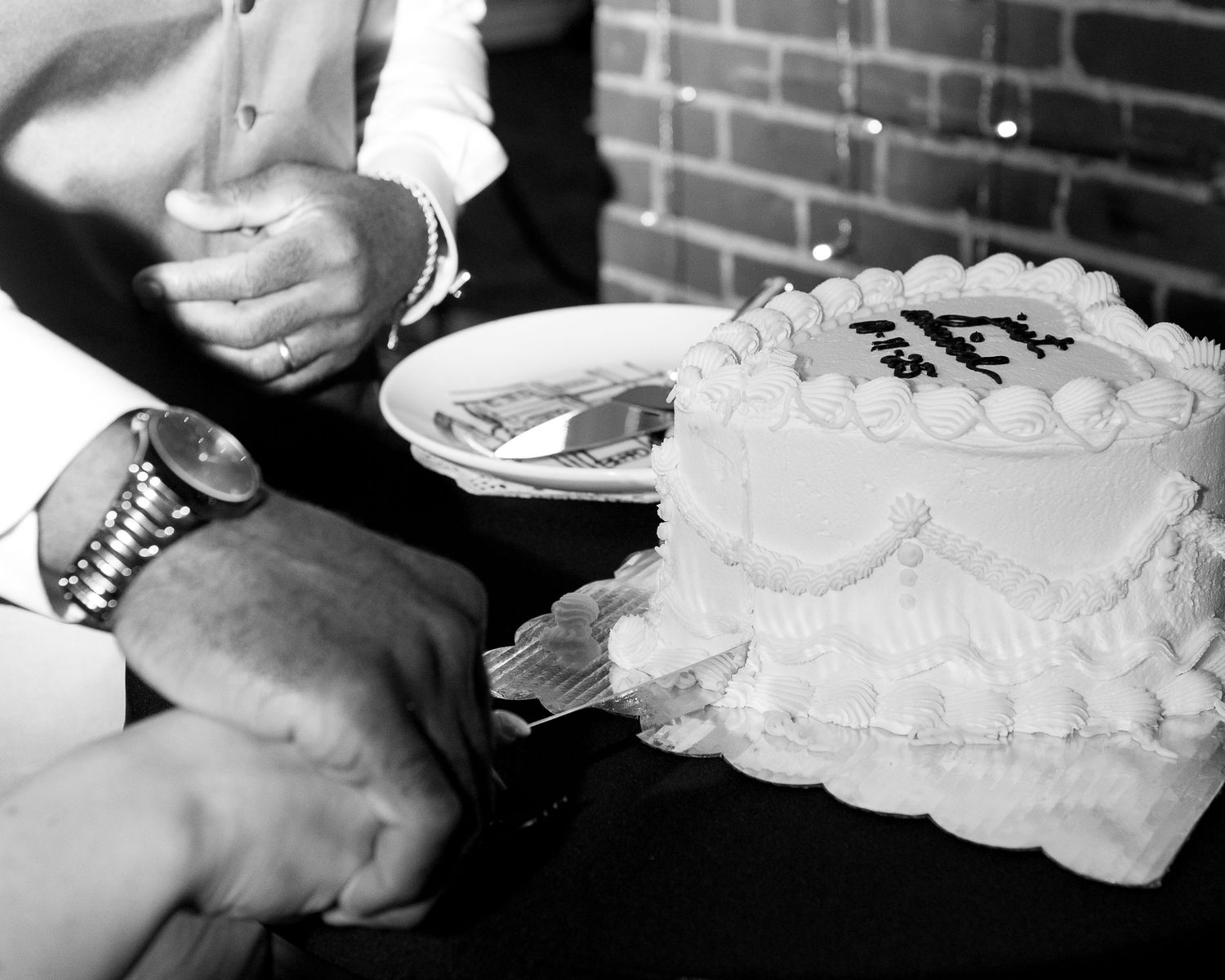 Close-up black and white details of lace wedding accessories.