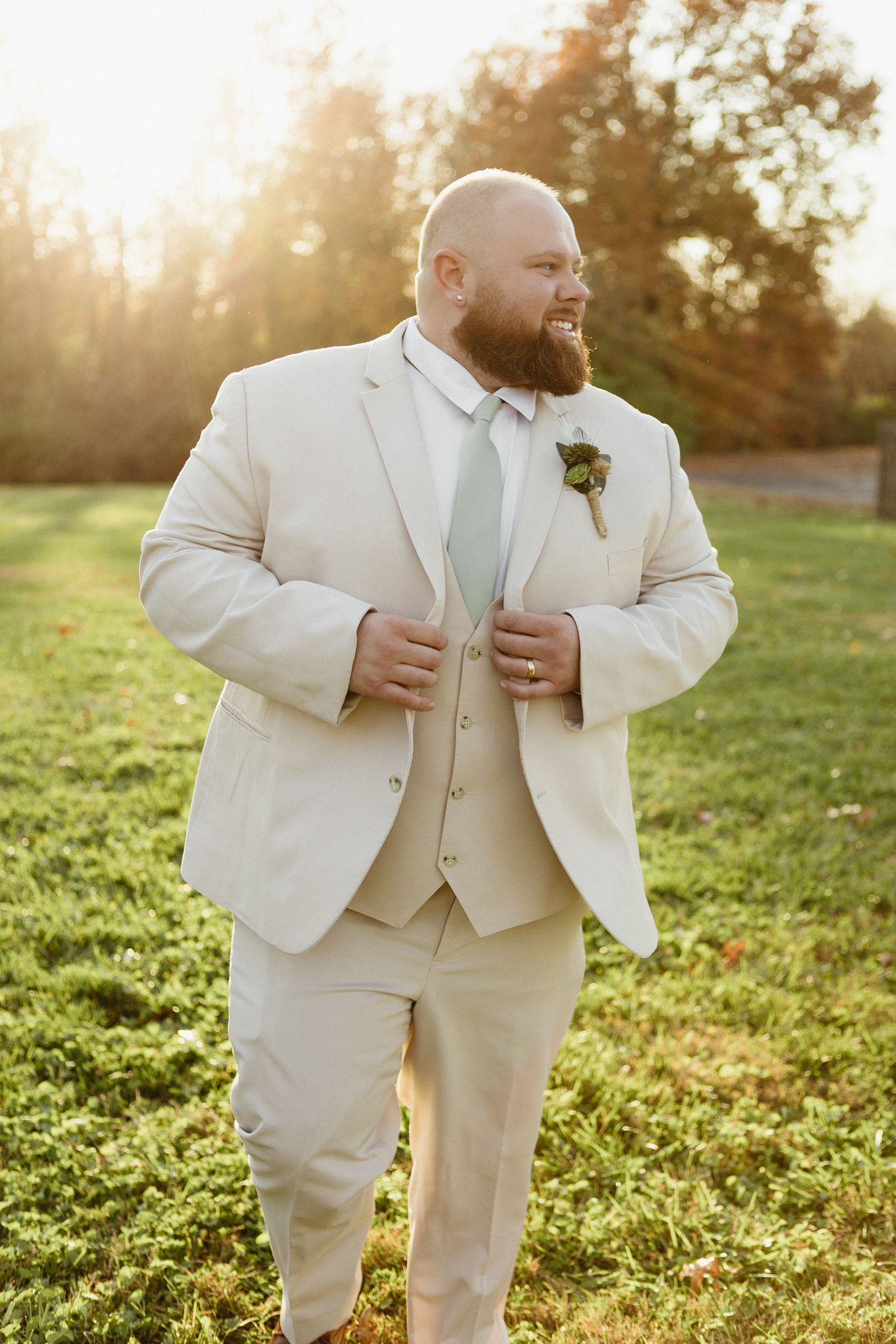 Multiple shots of a cream-colored wedding suit in a sunlit outdoor setting.