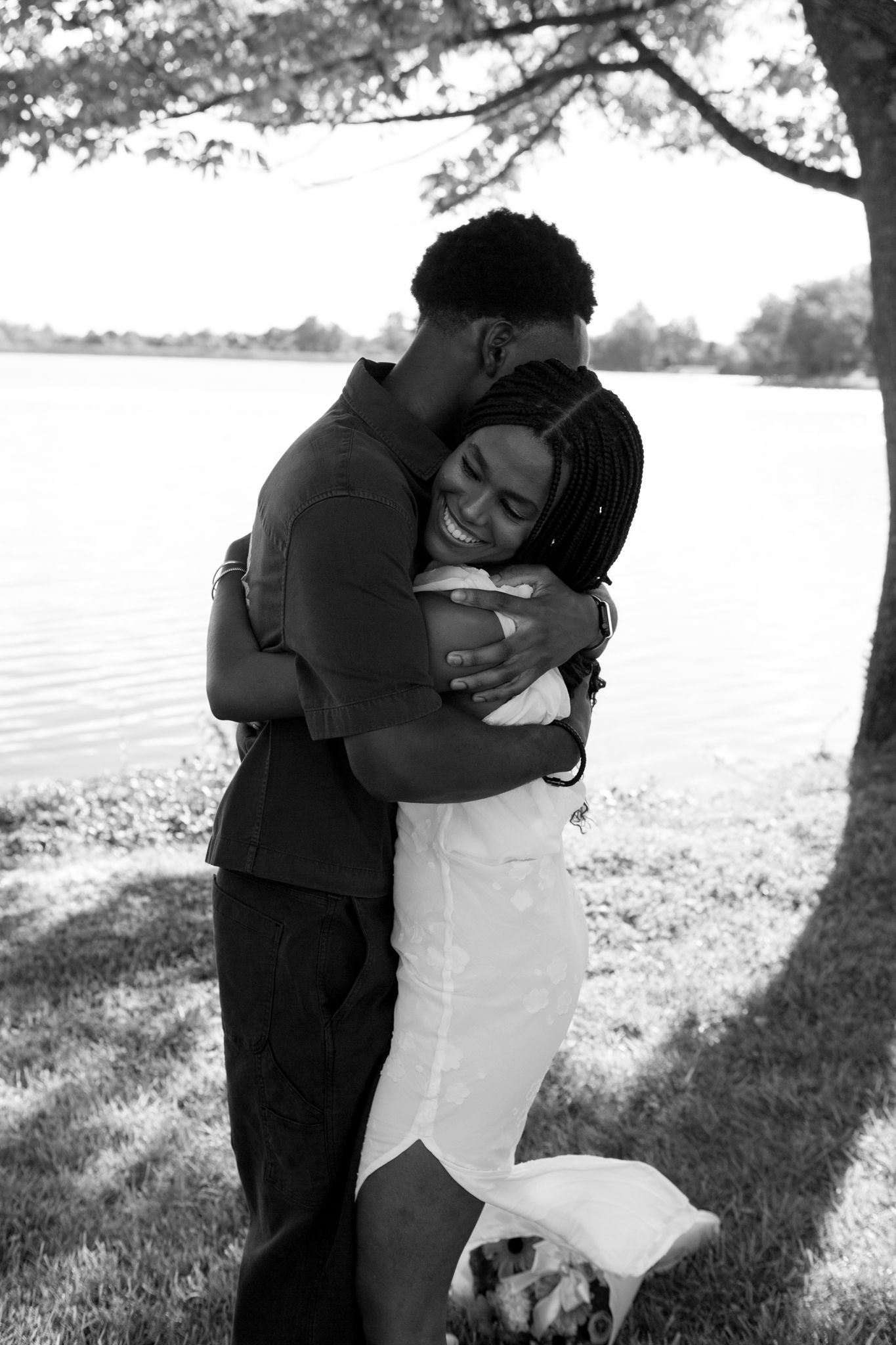 Joyful moment as Belle says yes to Chadrack's proposal by a peaceful lake in Kentucky.