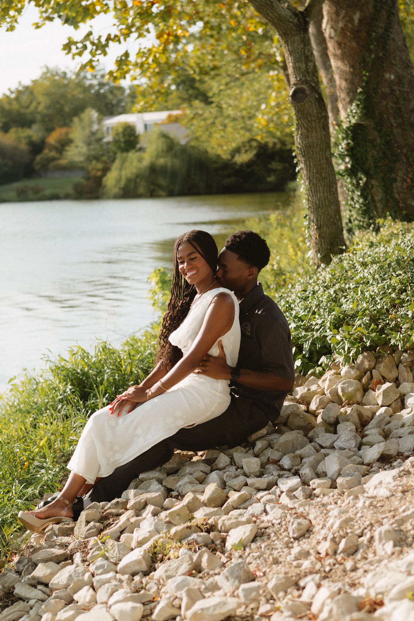 Romantic proposal at a lakeside location in Lexington, Kentucky, with a young Black couple.
